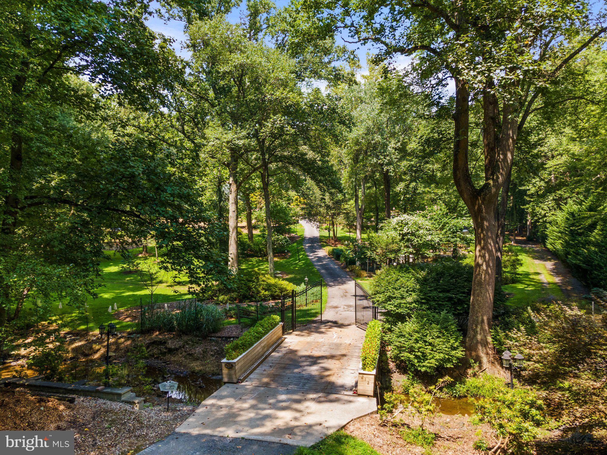 Welcome to Shangri La.  Premium secluded 5 acre Lot in the Cloverly area of Colesville .  This little slice of Heaven can be yours.  This former homesite is fully developed.  There are hundreds of very mature azaleas that explode with color all spring.  Mature rhododendrons scattered  around  the property add to the beauty.  Daffodils line the entrance drive.  Magnolia tree, Japanese  dogwoods, crepe myrtles and so much more will delight you.  The entire lot is fenced to keep deer from eating the well established landscaping.  There is a  lined pond with fountain.  Extensive hardscape throughout the property.  There is a separate party pavilion that has heat and air conditioning.  Storage sheds and even a chicken coop.  Property is perc'd for a 5 bedroom home.  There is existing electrical service on site.