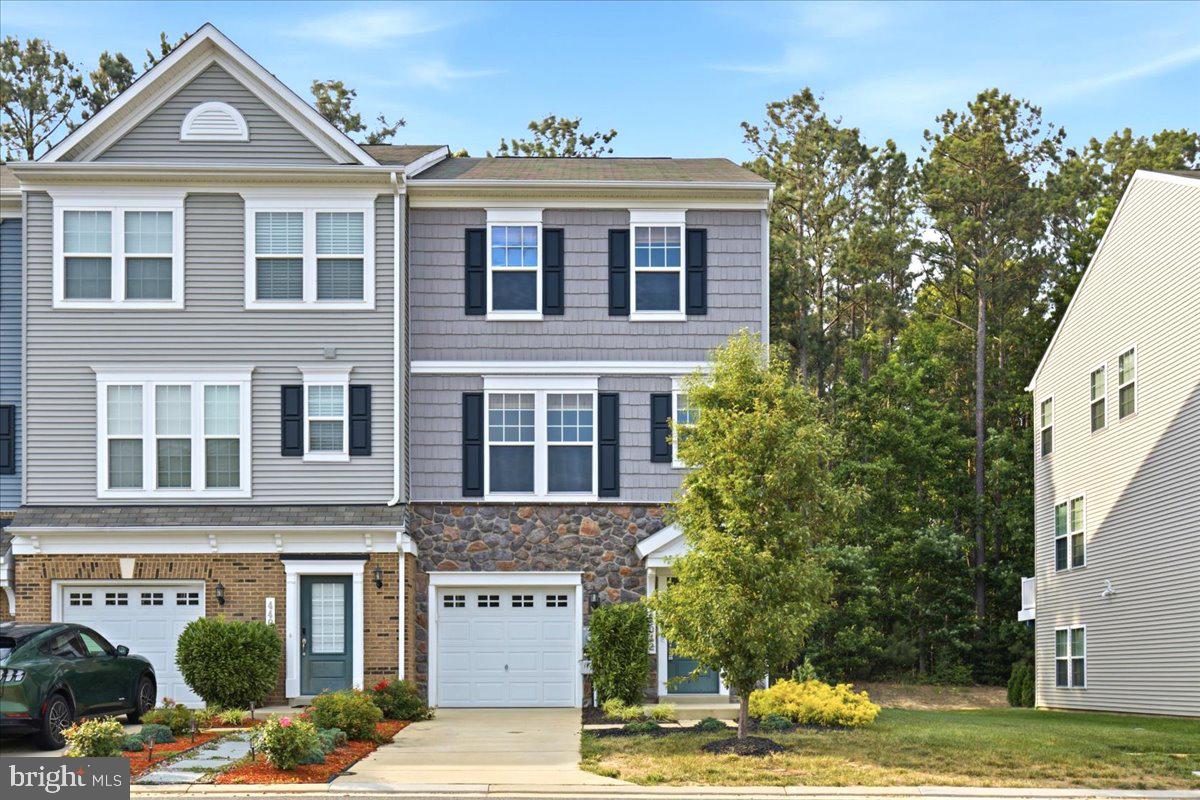 Welcome to 44042 Eucalyptus Way in the sought-after Wildewood community of California, MD — a beautifully maintained, nearly new townhome offering modern finishes, flexible living space, and a location that’s hard to beat. Built in 2021 and thoughtfully designed across three finished levels, this home combines style, function, and convenience for today’s lifestyle.

The main level is bright, open, and ideal for both everyday living and entertaining. At the heart of the home is a stunning custom kitchen featuring a huge center island, stainless steel appliances, built-in microwave, abundant cabinetry, and a spacious dining area. Just off the dining space, step out onto the rear deck overlooking a secluded backyard, creating the perfect setting for morning coffee, outdoor dining, or simply unwinding in a peaceful outdoor space. The kitchen flows seamlessly into the large family room, making the entire main level feel connected and inviting.  The main level and lower levels feature beautiful LVP flooring.

Upstairs, you’ll find comfortable bedroom space and well-appointed baths, while the finished lower level offers a valuable bonus room/bedroom, ideal for guests, a home office, gym, playroom, or additional living space to fit your needs. A one-car garage adds everyday convenience and extra storage.

Located in the amenity-rich Wildewood neighborhood, residents enjoy access to community amenities such as a pool, clubhouse, tennis courts, playgrounds, parks, and walking trails. The HOA also includes trash pickup, recycling and snow removal.  Commuters will especially appreciate the home’s close proximity to PAX River Naval Air Station, along with nearby shopping, dining, and everyday conveniences throughout California and Lexington Park.

If you’ve been looking for a move-in ready home with modern style, flexible space, neighborhood amenities, and an easy commute to PAX River, 44042 Eucalyptus Way is one you won’t want to miss.