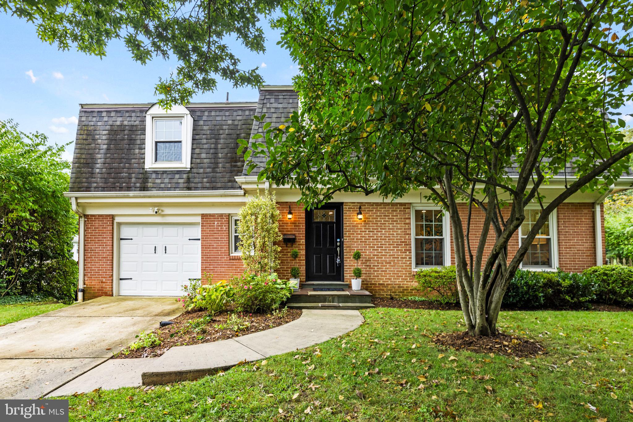 Stunning Dutch Colonial, boasting 4 bedrooms, 3.5 bathrooms, PLUS an office AND a den on 3 finished levels with nearly 4,000 SF of living space! Situated on a large, gorgeous, private, fenced corner lot in Maplewood Manor, this home offers a dramatic open floor plan thanks to a large addition. The family/living room showcases stunning cathedral ceilings and hardwood floors. Inviting living room off the kitchen features a wood burning fireplace & cozy lighting, perfect for relaxing after dinner or hosting company.  Indoor - outdoor flow lives like a dream at this home with 3 large sliding doors providing access to a magical yard. Just off the dining room, a large wrap around terrace overlooks the beautifully landscaped and fenced back and side yards with an inviting garden, brick patio, and extensive greenery—perfect for relaxing or entertaining. You'll even find a kitchen herb garden right outside the kitchen door!  Upstairs you'll find a TRUE 4 bedroom plus a BONUS office/den/nursery space. The spacious primary bedroom includes a HUGE walk-in closet and spa-like en-suite bath with a dual vanity and shower. The three secondary bedrooms are generously sized with ample closet space and share a large hall bath with a deep soaking tub and designer tile.  The newly renovated lower level features a large rec room, another den, a full bath, and a laundry room with a utility sink. A 1-car garage offers extra storage, and the driveway provides parking for two additional cars! Location is unbeatable: 2 blocks to Maple View - Alta Vista Park, minutes to Bethesda and Chevy Chase for premium shopping and dining, and just a bit further to the Strathmore Music Center for great entertainment. Close to NIH, Suburban Hospital, Walter Reed, The French School, and more! Commuter-friendly with easy access to 495 and other major routes, plus just 1.5 miles to the Medical Center Metro and a block from the bus stop. Located in the Wyngate / North Bethesda / Walter Johnson school district. A perfect combination of space, location, and convenience—Welcome Home!
