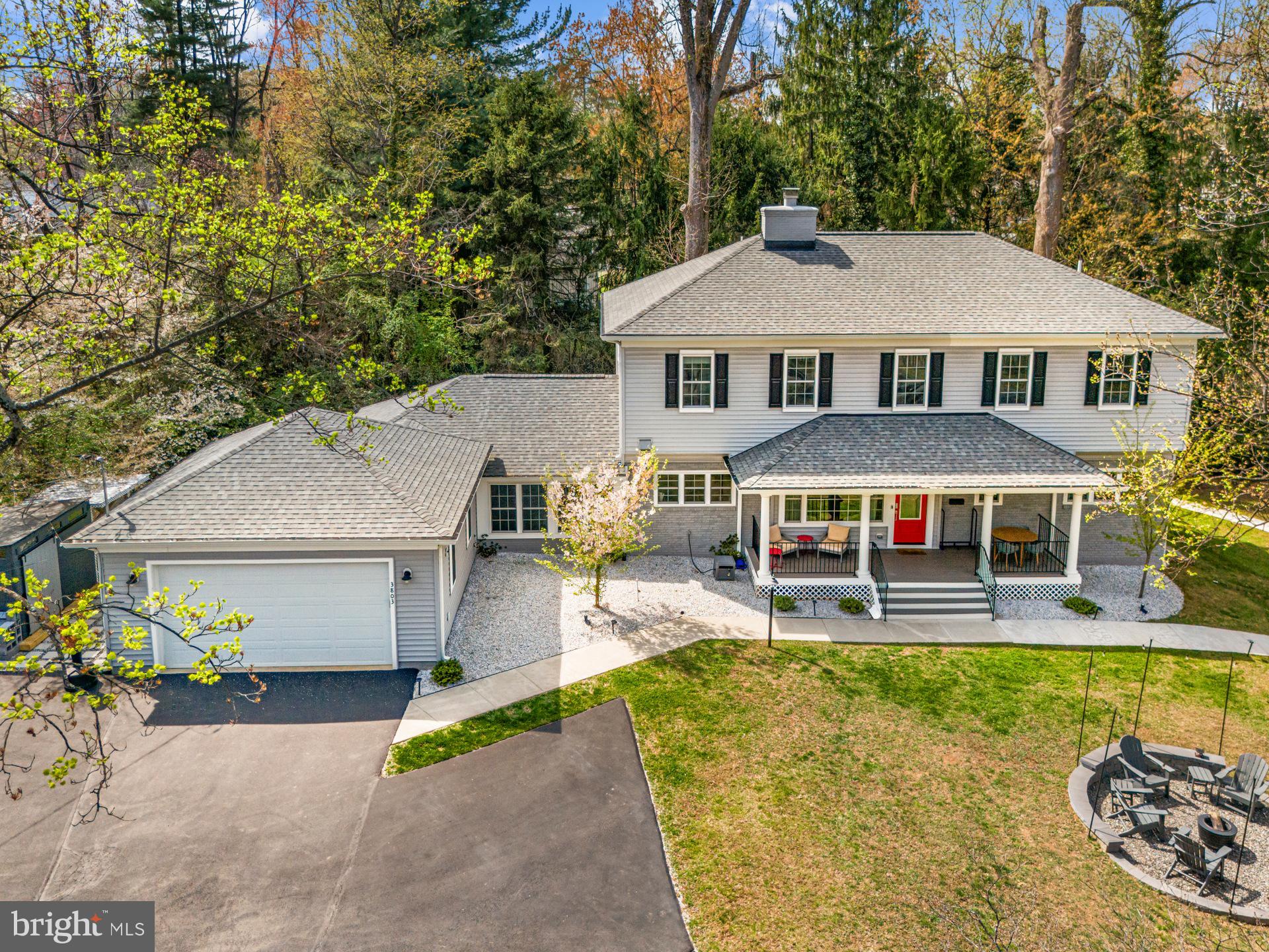 Fully rebuilt and expanded in 2022, this exceptional custom residence is set on a private 0.69-acre lot with no HOA and showcases rare features including a 14-car driveway and resort-style outdoor kitchen, an offering seldom found at this price point.
Blending the feel of newer construction with mature landscaping, privacy, and extensive post-build upgrades, the home delivers a level of space, functionality, and outdoor living that stands apart from typical Fairfax offerings.

With over 3,300 square feet, 5 bedrooms, and 4 full baths, the layout is designed for flexibility, including a true main-level suite plus an additional bedroom and full bath, ideal for guests, multi-generational living, or a dedicated office setup.

The main living space is designed for both comfort and entertaining, featuring a chef’s kitchen with a professional 48” gas range that opens seamlessly to the breakfast area and spacious Great Room with a brick wood-burning fireplace. A vaulted morning room fills the space with natural light and adds architectural character rarely found in newer homes.

Upstairs, the primary suite offers a spa-like bath with an oversized shower, while two additional bedrooms share a Jack-and-Jill bath. Hardwood flooring extends throughout the main level, upper hall, and primary suite, complemented by new carpet and fresh paint in the secondary bedrooms.

Since completion, the owners have further elevated the home with custom designer paint, upgraded lighting, and a fully outfitted home gym in the garage. A Tesla charger adds modern convenience for EV owners.

The outdoor experience is where this home truly distinguishes itself, thoughtfully designed for both entertaining and everyday enjoyment. A covered outdoor kitchen, expansive flagstone patio, and extensive hardscaping are complemented by a 450 sq ft gazebo with solar lighting, a fire pit area with pergola and smokeless fire pit, and multiple gathering spaces throughout the property. Over 30 evergreen trees and blooming cherry blossom trees create a private, park-like setting, enhanced by low-maintenance rock landscaping.

For recreation and versatility, the property includes a trampoline, zip line, volleyball net, and jungle gym, along with dedicated storage via a 12x8 shed, bicycle shed, and organized firewood area, features rarely found in combination at this price point.

The expansive lot also offers future potential for a guest house, pool, or additional outdoor amenities, providing long-term flexibility and value.

A rare and highly valuable feature is the expanded driveway accommodating up to 14 vehicles, offering flexibility that is nearly impossible to find in newer construction.

Additional features include 9’ ceilings on both levels, a mudroom, three-zone HVAC, Trex front porch, and a cellar for additional storage.

Located just minutes from daily conveniences, the home is also within a 5-minute walk to Ashby Pond Conservatory and park and Daniels Run Park with trails and creeks, offering a unique blend of privacy and access to nature.

Homes offering this combination of newer construction, usable land, no HOA, and exceptional parking capacity are rarely available, making this a compelling opportunity for buyers seeking both value and lifestyle at this price point.