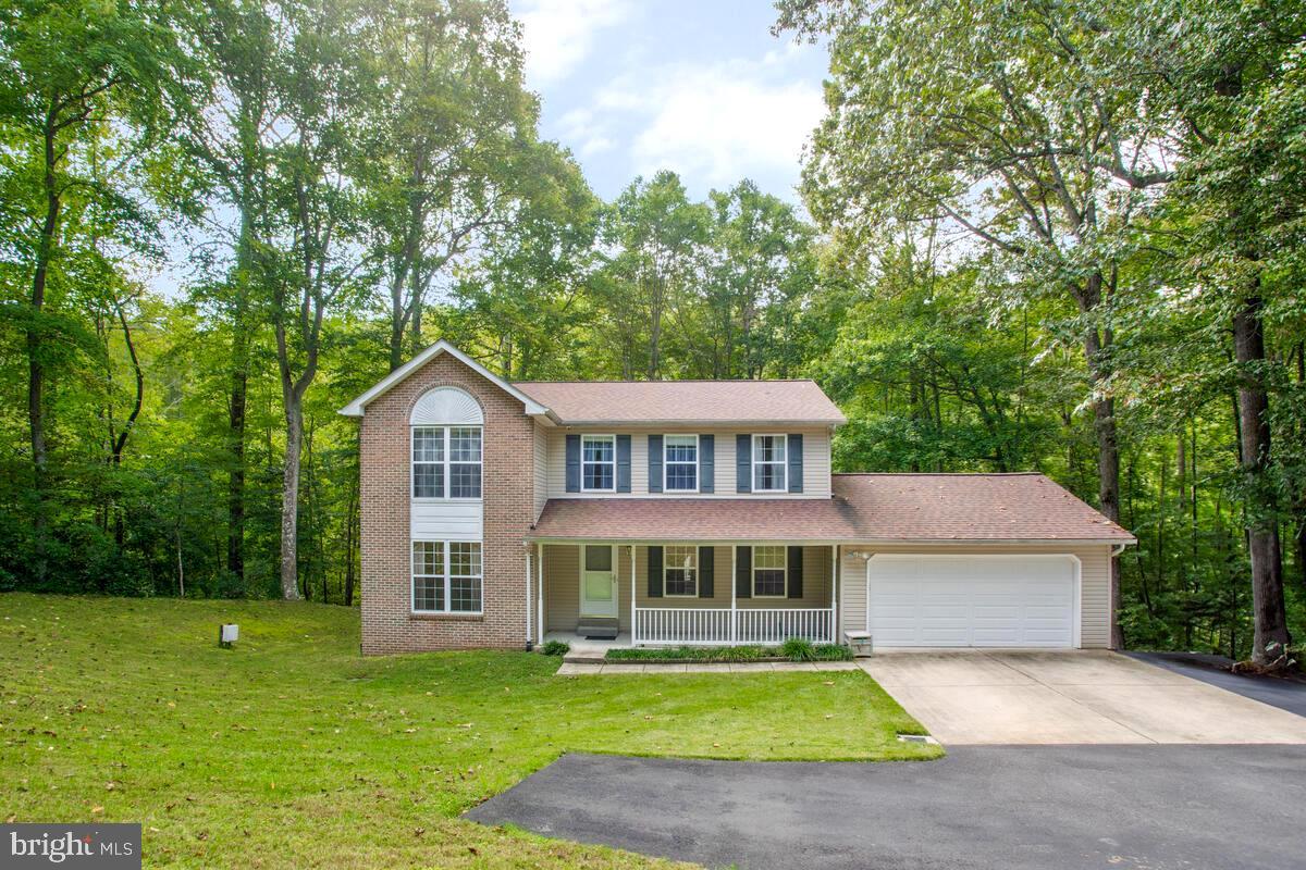Nestled in the serene backdrop of nature's wonderland in  Dunkirk, MD, this exquisite 4-bedroom, 3.5-bathroom residence at 9710 Tara Drive boasts a generous 3330 sq. ft. of living space. The property offers an oasis of privacy, as it is bordered by lush trees ensuring tranquility away from the bustle of Route 4. Recently updated with a new roof in September 2021, a fresh well pump in September 2022, and an upgraded heat pump as of November 2023, this home promises modern comforts wrapped in peace of mind. The vast back deck invites endless entertainment possibilities, while the 2-car garage and paved driveway cater to your automotive needs. An extensive drainage system directs water run-off to the back ravines. Central air conditioning ensures year-round comfort. Located conveniently close to local shopping and restaurants, this home is an exceptional find for those seeking convenience without compromising on privacy.