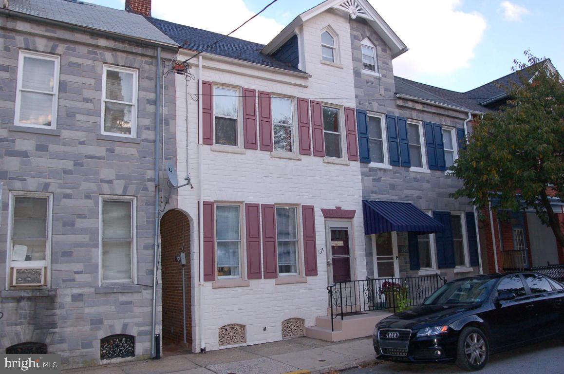Great Chestnut Hill Location.  This very well maintained 3 bedroom 1 bath house has updated furnace and central air.  Modern kitchen and bath.  Natural wood floors, some exposed brick all this with a private rear patio and 2 car covered carport.