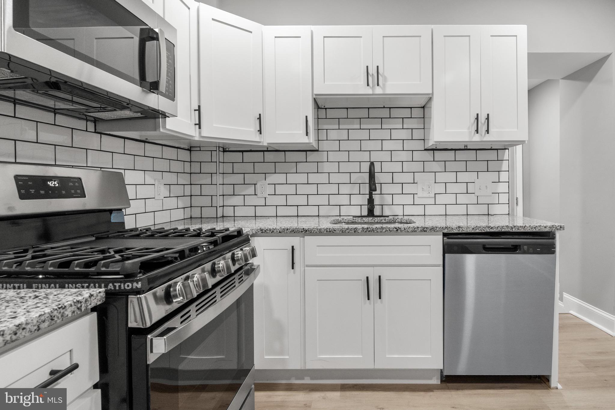 Beautiful 2-bedroom, 1-bathroom townhouse in the desirable Pigtown/Washington Village neighborhood. Features include luxurious vinyl flooring throughout, a modern granite countertop in the kitchen, and a fenced-in rear yard for privacy and outdoor enjoyment. Conveniently located near M&T Bank Stadium, Camden Yards, Topgolf, and major routes 95 and 895, offering easy access to entertainment, shopping, and transportation. Perfect for comfortable urban living!
