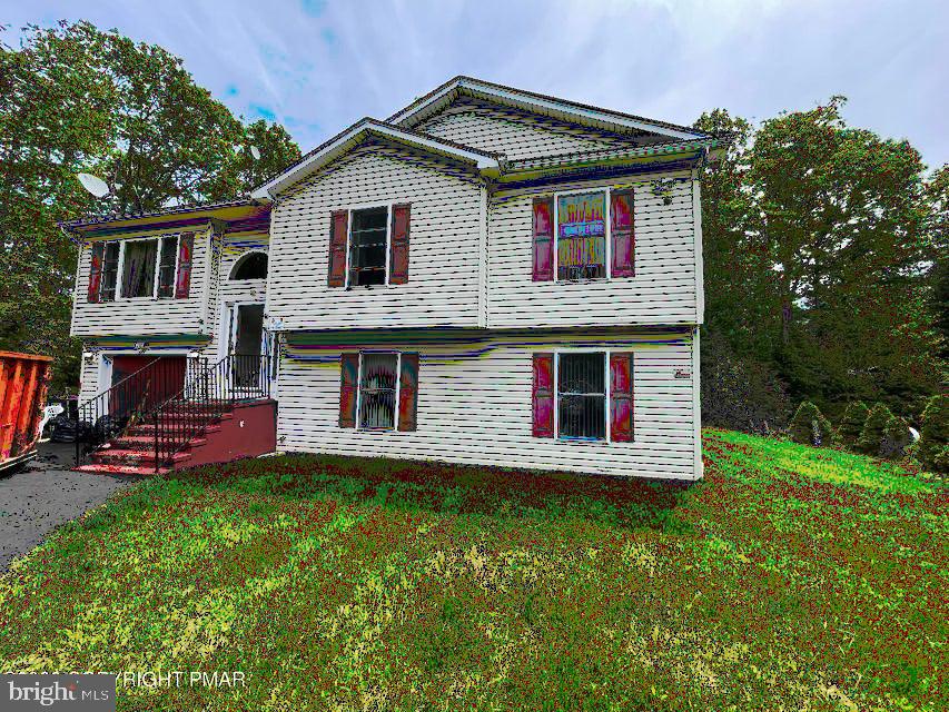 Welcome to this spacious 5 BEDROOM AND 3 FULL BATHROOM bi-level home located in the highly desirable Pocono Farms Country Club community! Situated on a quiet cul-de-sac, this versatile property offers an open-concept floor plan with plenty of room for family, guests, or rental potential. The main level features three generously sized bedrooms, including a comfortable primary suite, while the lower level offers two additional bedrooms and a full bathroom, providing flexibility for extended family, a home office, or recreation space. With a total of 5 BEDROOMS AND 3 FULL BATHROOMS, there's room for everyone. Additional highlights include an oversized one car garage, ample living space, and a layout that is perfect for both everyday living and entertaining. While the home could benefit from a little TLC, it presents an excellent opportunity to add your personal touches and build instant equity. Whether you're searching for a primary residence, vacation getaway, or investment property, this home offers outstanding value in a sought-after community. Pocono Farms Country Club amenities include a beautiful lake, oversized outdoor swimming pool, golf course membership opportunities, restaurant, fitness center, tennis courts, and more. Don't miss your chance to own a home in one of the Poconos' most popular amenity filled communities!