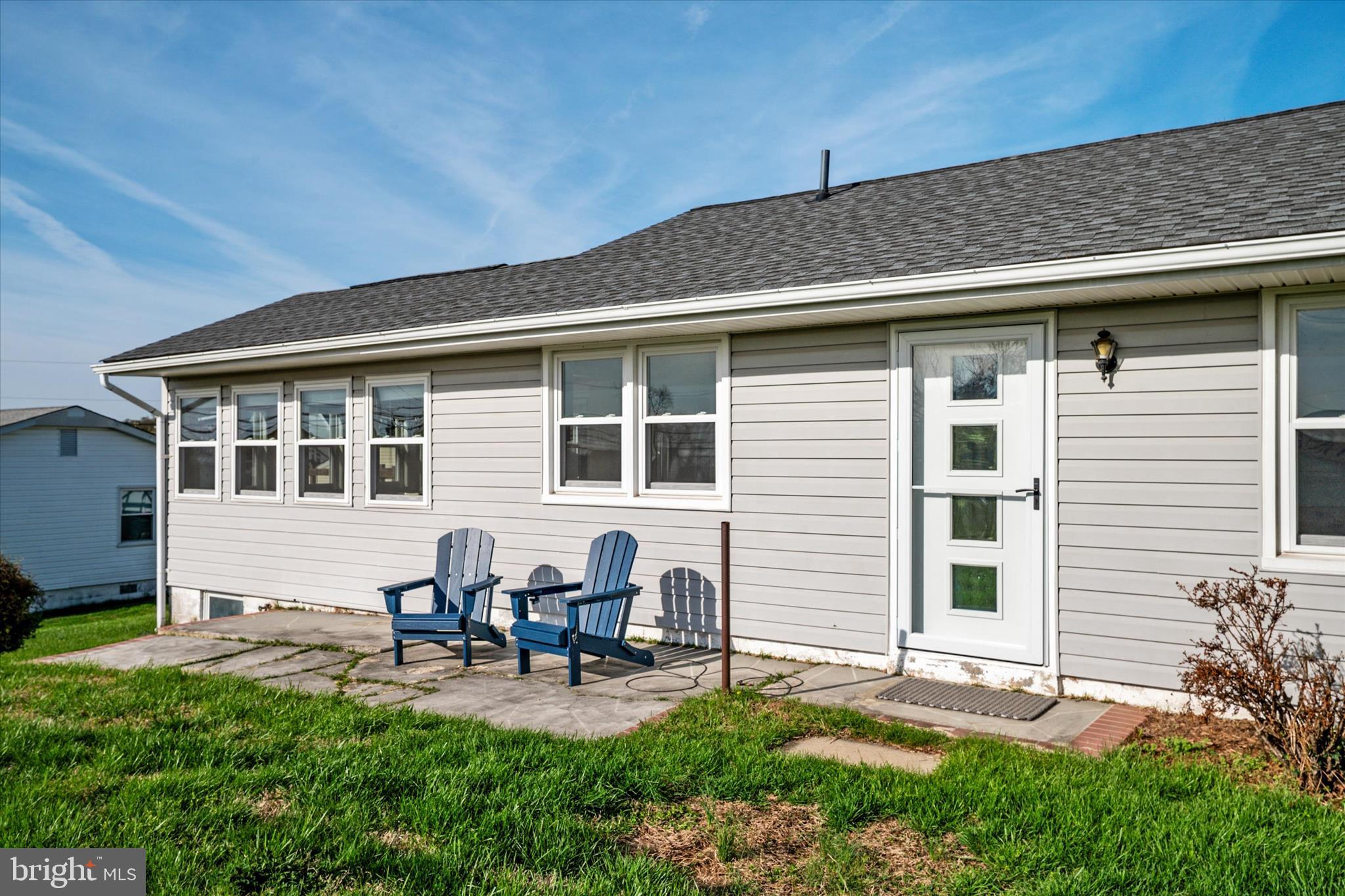 Welcome to 5115 Bay Parkway, an affordable vacation home and hidden coastal retreat tucked inside one of Huntingtown’s best kept secrets. Just about an hour from Washington, DC and Alexandria, this is where everyday life starts to feel like a getaway, without the hassle of Bay Bridge traffic.

Set within a charming waterfront community, this home offers access to a private neighborhood beach just a one minute walk from your door. Start your mornings with breathtaking sunrises over the Chesapeake Bay, spend your afternoons beachcombing for shark teeth, fossils, and sea glass, and wind down with moonrises over the water. From kayaking, paddle boarding, and fishing to simply parking a chair in the sand and relaxing, this is a place where life naturally slows down.

Nature lovers will feel right at home here, surrounded by the beauty of the shoreline and incredible wildlife, including herons, ospreys, bald eagles, shore birds, horseshoe crabs, and even otters. The community is golf cart friendly and offers some of the most desirable beach access in the area, along with a voluntary citizens association of just $65 per year, a community house for gatherings and events, and nearby Breezy Point Marina with slips and neighborhood access. The community also offers its own designated parking area with access to approximately 18 neighborhood boat slips.

Inside, the home blends thoughtful updates with easy, comfortable living. The kitchen was renovated in 2021, with additional improvements including windows and doors in 2022, HVAC and roof in 2020, and a whole house water filtration system. The sunroom is a standout space, offering gorgeous bay views and the perfect setting for morning coffee or a leisurely brunch. Outside, the back patio creates an ideal place to grill dinner and enjoy the sparkling water views as the day winds down.

The layout is simple and functional, making it ideal as a full time residence or weekend escape. There is also excellent practical storage for an active waterfront lifestyle, including a boat rack outside and basement space for kayaks, paddle boards, bikes, beach gear, and water sports equipment. A sump pump adds peace of mind and functionality to the lower level.

Beyond the neighborhood, outdoor recreation continues just minutes away. The American Chestnut Land Trust, about 10 minutes from the home, offers over 30 miles of scenic hiking trails through protected hardwood forest along Parkers Creek, making this a true paradise for bird watchers and nature enthusiasts.

You are also conveniently located just 15 minutes from the twin beach towns of North Beach and Chesapeake Beach, as well as Prince Frederick, and about 45 minutes to Solomons Island and Annapolis.

Whether you are looking to downsize, invest, or finally own an affordable beach house near DC, 5115 Bay Parkway is a rare opportunity to enjoy Chesapeake Bay living in a location many buyers have yet to discover.
Welcome to paradise!