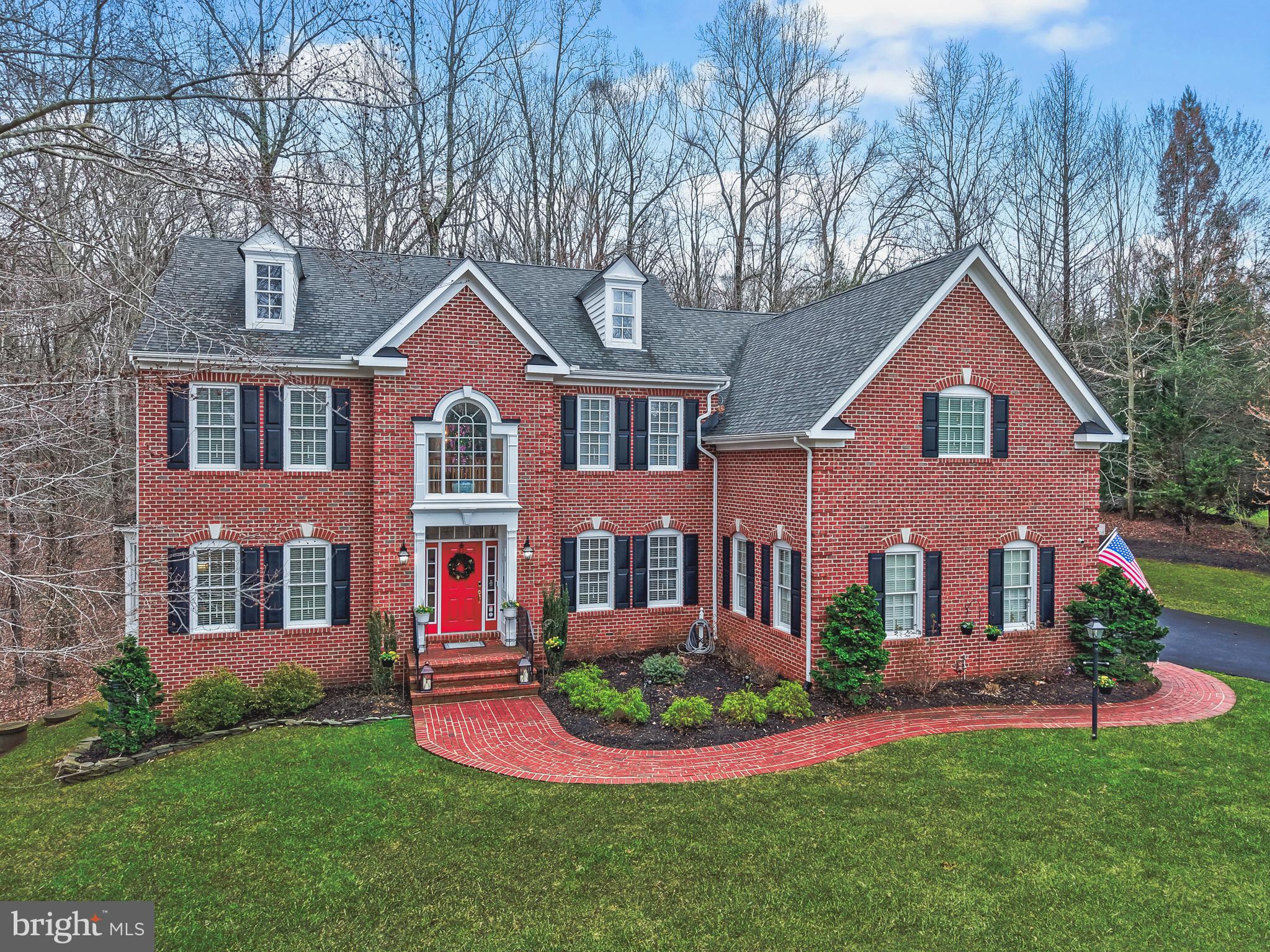 Nestled on a private 2+ acre cul-de-sac lot near the Occoquan River in sought after Riverbend,
7969 Pinnacle Ridge Dr invites you to imagine a life where luxury and serenity meet every day. As you step inside, warm wood floors, custom moldings/wainscoting, and a sun‑filled gourmet kitchen with a large island set the tone for effortless living and memorable gatherings. The two‑story family room with its striking fireplace feels like the heart of the home, while the private study and sunroom offer quiet corners to unwind. Upstairs, the spacious primary suite—with its own fireplace and dual walk‑in closets—creates a true sanctuary, complemented by the convenience of bedroom‑level laundry. The fully finished basement expands your lifestyle even further with a spacious rec room, wet bar, media room, fireplace, and abundant storage. Outside, the wooded cul‑de‑sac lot feels worlds away as you relax on the brand‑new full‑length Trex deck with gazebo, listening to birdsong and watching deer wander toward the nearby Occoquan River. The Riverbend community enhances the experience with friendly neighbors, holiday gatherings, pool parties, and a private nature trail along the river that’s simply beautiful. With Old Town Manassas, Two Silos Brewery, shopping, dining, PW Parkway, VRE, and Colgan High School all close by, weekends and commutes are equally convenient. Thoughtful updates—including a remodeled kitchen with GE Monogram appliances, new water heater, repaved driveway, new well pump, refurbished fireplaces, updated electrical, new high‑end windows, extensive landscaping, smart thermostats, and more—ensure this home feels as fresh as it is inviting. This is a must‑see property where comfort, community, and natural beauty come together effortlessly.