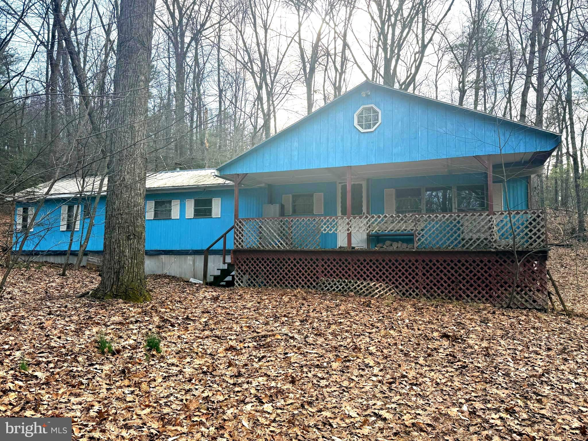 Tucked away on 2.11 wooded acres in scenic Perry County, 228 Pine Brook Drive in Newport, PA offers a rare opportunity to create your own private retreat surrounded by nature. Set among mature trees with abundant wildlife, this property is ideal for those seeking peace, privacy, and the beauty of the outdoors.

The existing home—a mobile home with an addition on a foundation—offers a starting point for your vision but requires a full renovation. Inside, you’ll find 3 bedrooms, 1 bathroom, and a spacious great room featuring vaulted ceilings, a cozy wood stove, and a loft area that adds character and potential. With the right imagination and updates, this structure could be transformed into a charming mountain getaway or weekend escape.

Whether you’re looking to renovate, rebuild, or simply enjoy the land as-is, the possibilities here are endless. Embrace the opportunity to design your dream home in a serene, natural setting while still being within reach of nearby conveniences.

Bring your ideas and make this hidden gem your own!