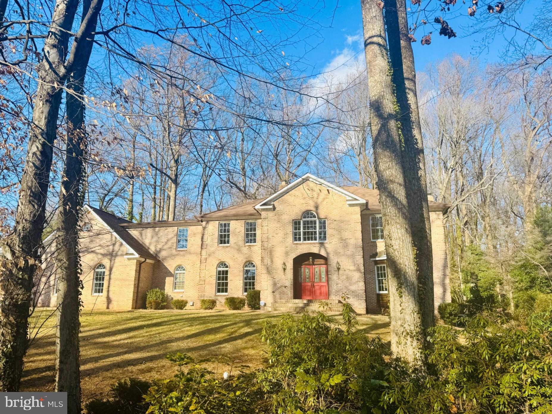 OFFERS DUE BY SUNDAY JAN 25 AT 4 PM.  OPEN HOUSE CANCELED FOR SUNDAY DUE TO INCLEMENT WEATHER. Exceptional opportunity in the highly sought-after Wakefield neighborhood of Annandale. This custom, quality-built all-brick residence, featuring corbeling style brick corners, offers 5 bedrooms, 5.5 baths, and 6,677 finished square feet of gracious living space on a ½-acre lot with no HOA.

The home is filled with natural light and features vaulted ceilings, a dramatic two-story great room with a floor-to-ceiling fireplace crafted by a local artisan/mason using historic settlement stones reclaimed from Loudoun County property walls. A private main-level office with brick fireplace provides an ideal work-from-home retreat. The layout is thoughtfully designed for both everyday living and entertaining, opening to a private deck and brick patio all situated on a level backyard framed by mature trees.

The spacious kitchen includes an island and eat-in area, with an adjacent laundry room for added convenience. A full bath on the main level offers flexibility, making the office a potential main-level bedroom option if desired.

The spectacular primary suite features a sitting room, fireplace, expansive bath, and generous his-and-hers closets. The upper level also includes an en-suite bedroom (princess suite) plus two additional bedrooms sharing a Jack-and-Jill bath.

The fully finished lower level offers an additional bedroom and full bath, a large recreation room with fireplace, game room, den, and a substantial storage/furnace room.

Additional highlights include a 3-car oversized garage, a recent roof (approximately 8 years old), solid oak interior doors, and solid all-brick construction.

Ideally located near I-495 and Route 236, with easy access to parks, shopping, and dining. The Mosaic District is just minutes away, featuring the Angelika Theatre, restaurants, and boutiques. Inova Fairfax Hospital nearby, with Vienna and Dunn Loring Metro stations approximately 3–4 miles away. Zoned for Woodson High School.