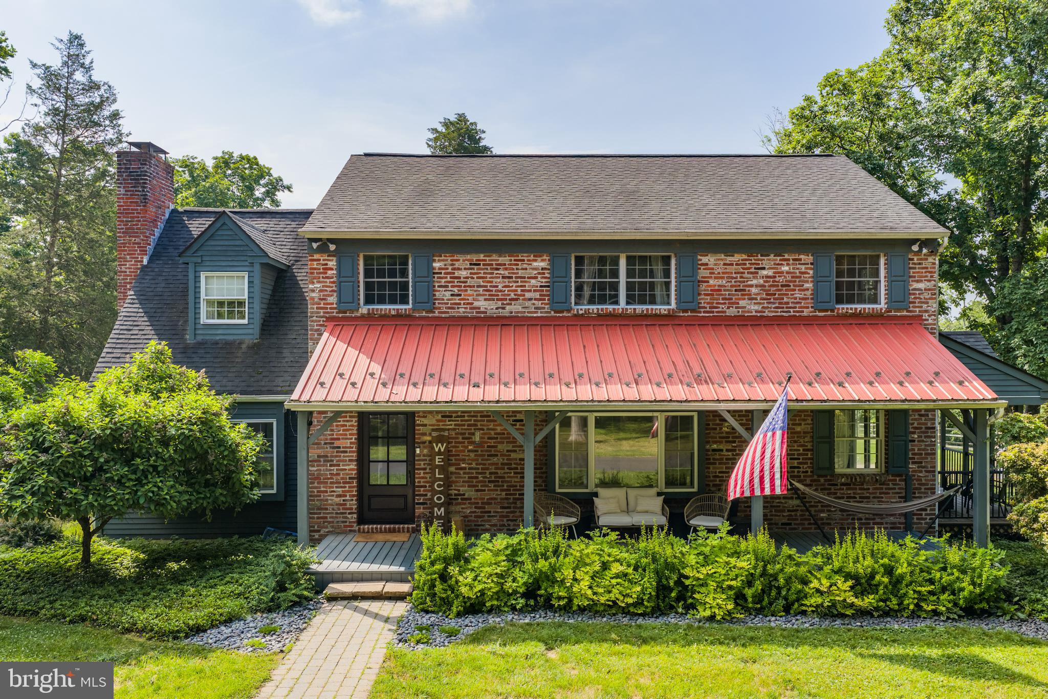 Bucks County living at its best! Welcome home to this stunning 4 bedroom farmhouse, tucked away on 11 acres in gorgeous Tinicum Township. From the moment you begin your way down the private, paved driveway, you know you are in for something special. As you arrive home, you are immediately greeted by this picture-perfect farmhouse surrounded by open space and enhanced by a detached 2-car garage/workshop, a dedicated fenced-in backyard and a storage shed. As you walk along the front walkway, past the welcoming front porch, and through the front door, you're immediately greeted by a perfect blend of timeless charm and modern updates. Directly to your left is a spacious living room warmed by a classic wood-burning fireplace. Continue into the custom-designed chef’s kitchen, complete with an oversized island with seating, stainless steel appliances and breathtaking views of your private backyard space. Just beyond is a flexible den/home office space with direct access to the backyard and a covered side porch. Don't overlook the dedicated dining room, an ideal space for entertaining family and friends. A large picture window frames views of the front, while bathing the room in natural light. Completing this level is a convenient full bathroom, a dedicated laundry and pantry space as well as an attached 2 car garage. Upstairs, you'll find four generously sized bedrooms, including a spacious primary suite featuring a walk-in closet and a large en-suite bathroom, complete with dual vanities, a soaking tub, and a separate shower. A large hall bath is equipped with a pedestal sink and walk-in shower, perfectly combining functionality and charm. Head downstairs to the versatile finished basement, a valuable bonus space that can serve as a recreation room, home office, gym, playroom, or whatever best suits your lifestyle! Step outside to your own private backyard oasis, featuring a large paver patio, lush landscaping, and seasonal river views. The expansive driveway provides ample parking for guests, recreational vehicles, or multiple cars, while the detached 2-car garage offers even more flexibility. Above the garage, you'll find a fully insulated loft complete with heating and air conditioning: a hobbyist's dream and the perfect space for a workshop, studio, home office, or creative retreat. Located just minutes from the banks of the Delaware River, this home offers the perfect balance of peaceful country living and modern convenience. Enjoy the tranquility and privacy of an expansive rural setting while remaining within easy reach of some of the region’s most desirable destinations. Spend your weekends exploring the charming river towns of Point Pleasant, Stockton, New Hope, and Lambertville, each known for their unique shops, restaurants, galleries, and year-round events. For commuters or those seeking a night in the city, nearby rail access makes it easy to enjoy all the culture, dining, and entertainment of Philadelphia and New York City. A property this special is truly a once-in-a-lifetime opportunity and 75 Mount Airy Road is ready to welcome its next chapter. Don't miss your chance to experience it for yourself!