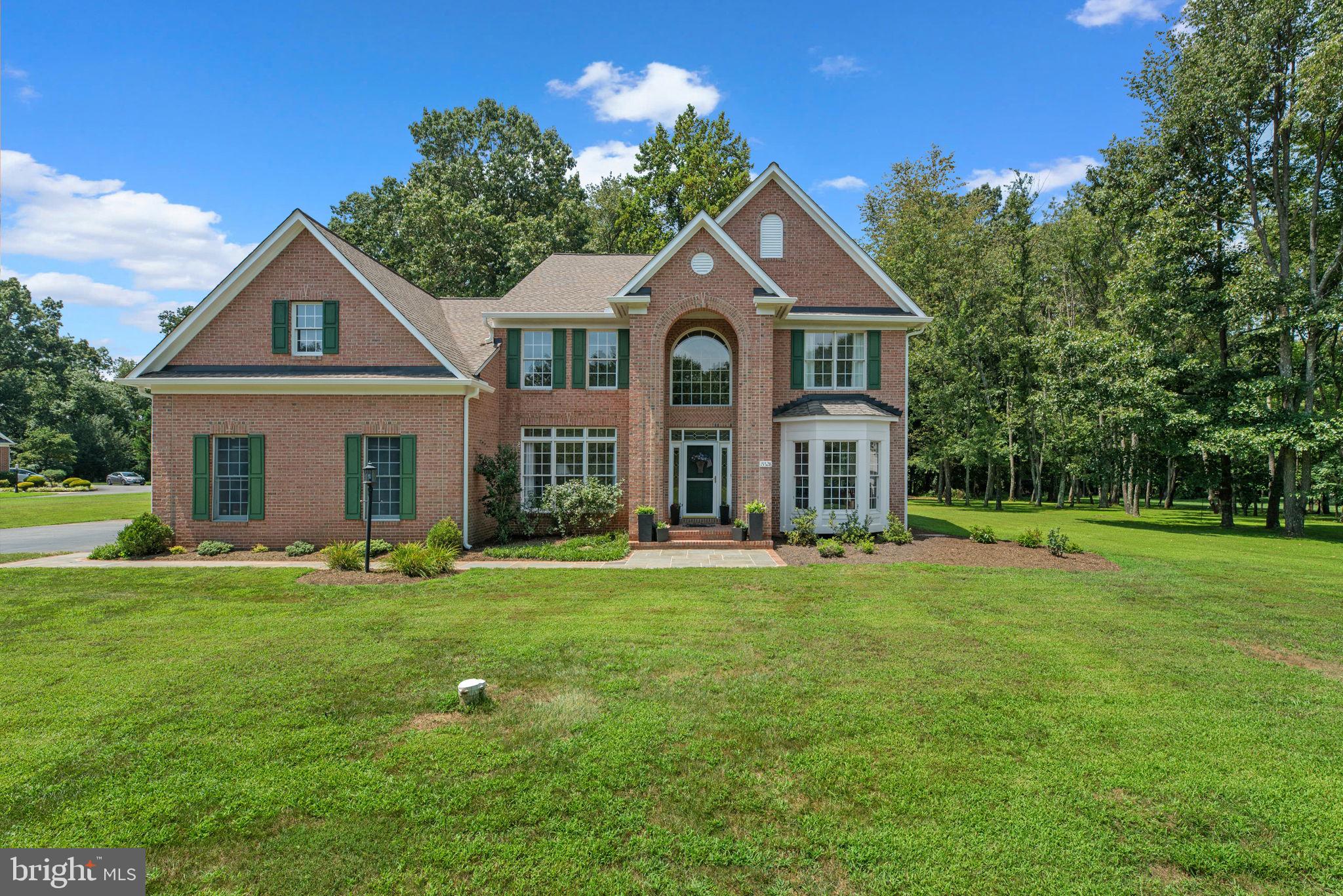 Nestled in the serene enclave of Peacefields of Cattail Creek, this exquisite Colonial residence offers a harmonious blend of luxury and comfort, perfect for those seeking an upscale lifestyle. Spanning an impressive 3,968 square feet, this home is designed to cater to both relaxation and entertainment, featuring high-end finishes and thoughtful details throughout. Step inside to discover an inviting open floor plan that seamlessly connects the living spaces. The gourmet kitchen is a culinary enthusiast's dream, equipped with Whirlpool stainless steel appliances, including a double wall oven and a down-draft cooktop. The expansive island provides ample space for meal preparation and casual dining, while the adjacent breakfast area invites morning gatherings. Elegant crown moldings and chair railings enhance the sophisticated ambiance, complemented by rich hardwood flooring that flows throughout the main level. The family room, adorned with a cozy wood-burning fireplace, serves as the heart of the home, perfect for intimate evenings or lively gatherings. A formal dining room and a separate living area provide additional spaces for entertaining, ensuring that every occasion is met with style. Retreat to the luxurious master suite, featuring a spacious walk-in closet and a spa-like bathroom complete with a soaking tub and a stall shower. Each of four additional bedrooms offers generous space and comfort, making this home ideal for hosting guests or creating personal sanctuaries. The fully finished basement adds versatility to the property, providing a heated space that can be tailored to your needs-be it the large home theater, gym, 2nd office, or play areas. Outside, the meticulously landscaped 1.2-acre lot offers a private oasis, backing to lush trees that provide a tranquil backdrop. Extensive hardscaping and exterior lighting create an inviting atmosphere for outdoor entertaining, while the patio is perfect for al fresco dining or simply enjoying the serene surroundings. The attached side-entry garage accommodates three vehicles, with additional driveway space for guests. This home is not just a residence; it's a lifestyle. With its blend of luxury, comfort, and natural beauty, it invites you to create lasting memories in a space that truly feels like home. Experience the elegance and warmth of this exceptional property, where every detail has been thoughtfully curated for your enjoyment.