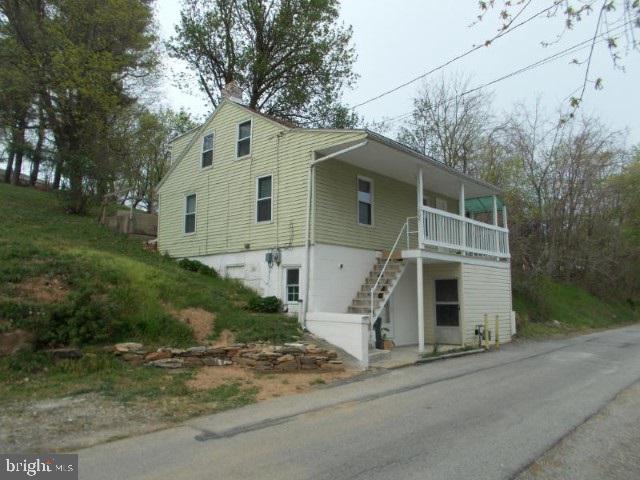 A little bit of country in the middle of town - 3/4 acre lot with efficient, move-in ready, cozy home - roomy garage with electric and wood stove. Seller in process of having a tax re-assessment done on property-