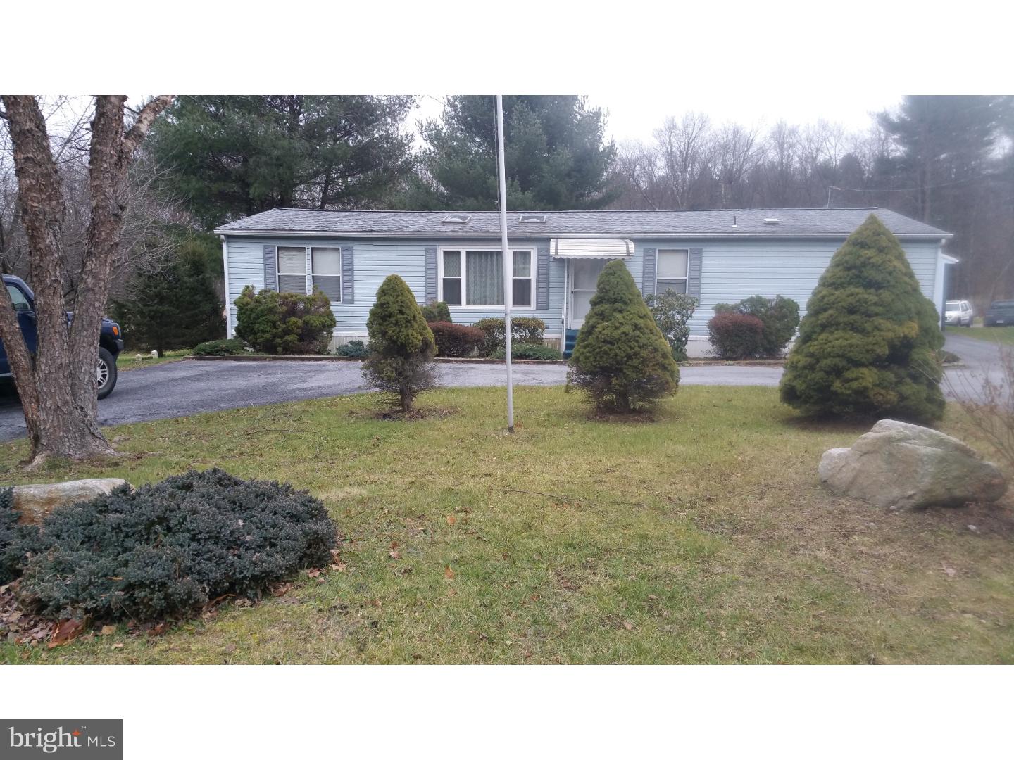 Double Wide manufactured 3 bedroom 2 full bath home on .43 acre lot with oversized 4 car garage.