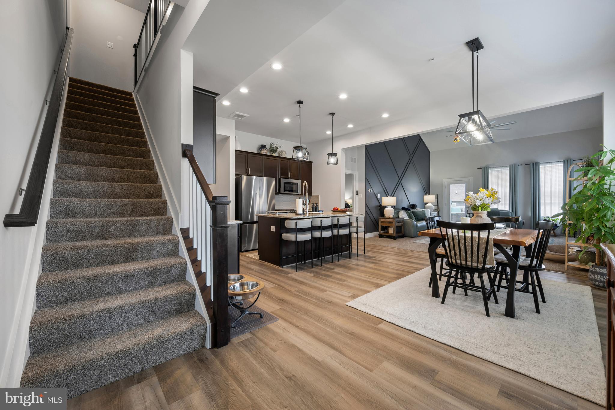 Welcome home to this stunning end unit craftsman townhome in the newer community of Snaders Summit in New Windsor. Looking for a bedroom and full bath on the main? Look no further! This immaculate villa offers 5 bedrooms and a finished basement with rough in for another full bath, unlike many of the units in this peaceful community. This gorgeous, turnkey home features 5 bedrooms (most with walk-in closets) 2.5 baths, a contemporary custom accent wall in the main living room, plenty of entertaining space, a cook's dream kitchen with stainless steel appliances & granite countertops, large maintenance free Trex deck, and a lovely open concept main floor. The large loft upstairs offers additional flexible space. Vaulted ceilings make this already spacious home feel even more grand. Move right in with nothing to worry about! Book your showing today, and start enjoying all that this luxury villa has to offer! Modern, sleek perfection all wrapped into one home! You could not ask for more! Conveniently located near shopping, dining, entertainment and major MD routes 27, 31, 97 and 140. Need to commute to DC? Thanks to its convenient location and quiet nearby backroads, your drive to DC, Baltimore and surrounding areas will be a breeze! Won't be on market long!