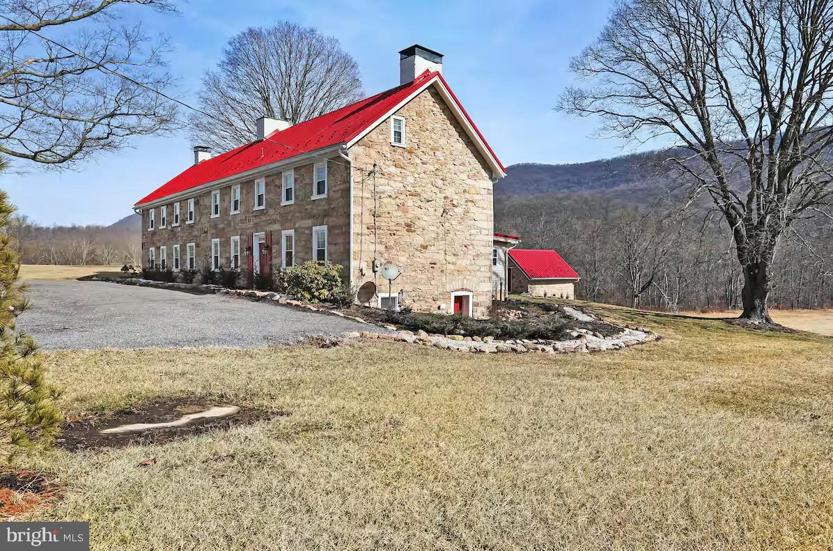 Step into history with this meticulously restored 6-bedroom, 5 full and 2 half-bathroom estate, proudly listed on the National Register of Historic Places. Dating back to the late 1700s, this 5,417 sq. ft. home has been thoughtfully updated to honor its historic charm while providing modern conveniences.
Nestled on 29 private acres, the property offers a tranquil retreat with two picturesque ponds, a dock, an adjacent trout stream, and a 16x16 tree stand platform—perfect for nature lovers and outdoor enthusiasts. Additional features include a 40x50 Quonset hut with a concrete floor, ideal for storage, and a 35x50 barn with an overhang.
Inside, the home’s spacious and inviting layout includes a first-floor primary suite, four generously sized second-floor bedrooms, and a sixth bedroom on the third floor. With its blend of history, elegance, and natural beauty, this property is ideal as a private residence, a serene getaway, or a unique investment opportunity.
Located just a short drive from Whitetail Ski Resort, Cowans Gap State Park, and Historic Gettysburg, this estate offers the perfect balance of seclusion and accessibility.
Don’t miss the chance to own this one-of-a-kind historic treasure!