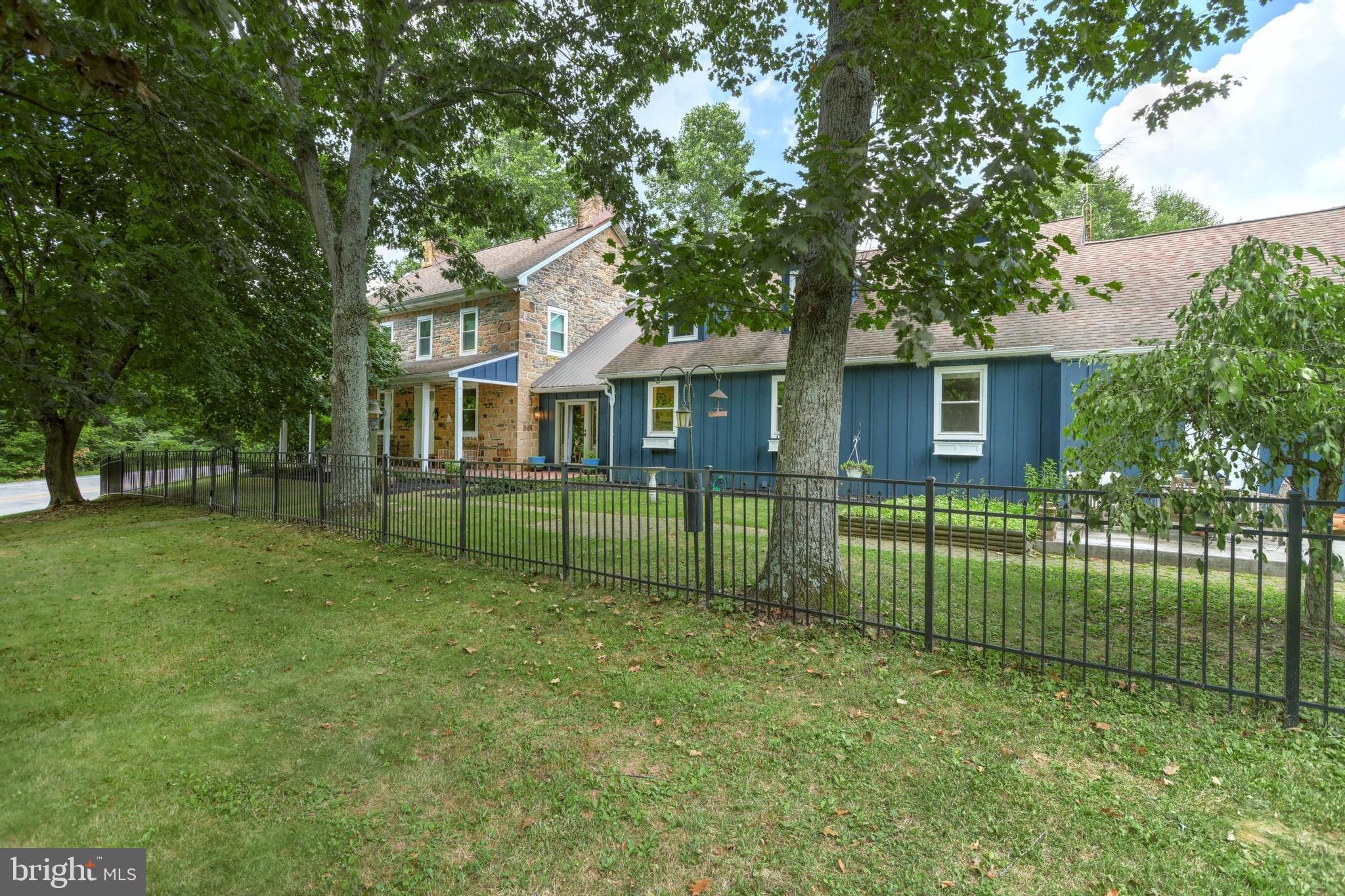 This historic estate, built in 1772 by Nicholas Wierman, features 5377 square feet, 7 bedrooms, 3Â½ bathrooms on 27 acres! A grand stone home greets you in a quiet a rural setting. The great room is punctuated by a beautiful stone fireplace and features an elevator that goes from the basement to the second floor! The cozy, sunlit dining room also has a wood burning, stone fireplace. A large addition to this historic home was added in 1985 and features a brand-NEW kitchen with a large island and quartz countertops throughout.  Adjacent to the kitchen is a butlerâs pantry with a great deal of storage and shelves. Down the hall is the main floor laundry room and further down is the 2-bedroom in-lawâs quarters/apartment/guest quarters that was renovated in 2017.  The upstairs features 4 bedrooms in the original stone part of the home and a large primary bedroom and bath in the addition. The home has 18 USDA tillable acres and is in land conservancy, certified clean and green. A one acre duck pond can also be found here. Across the street is 5 acres where the lovely Bermudian Creek flows through the property. A bank barn with upper storage can also be home to chickens, horses or other livestock in the lower barn.  There is plenty of storage in the addition to the barn.  Also located on the property is a shop with shelves and storage plus an outlet for your RV.  This could be the secluded haven youâve been looking for.  Just miles from Gettysburg, 25 miles to Harrisburg and less than 50 miles to Frederick. Make sure you check out the floor plan at the end of the photos.