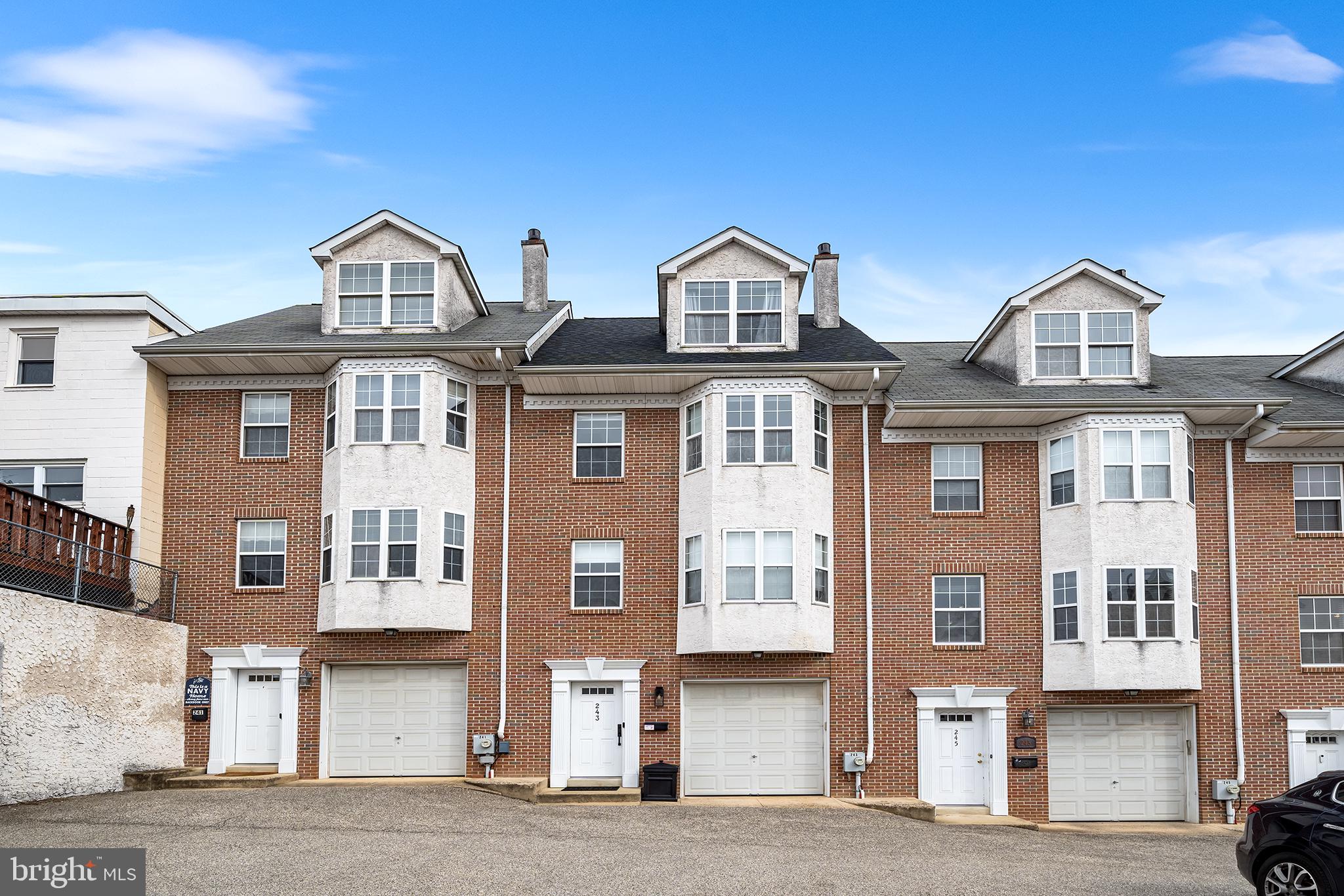 Welcome Home to this magnificent townhome in the heart of the vibrant neighborhood of Manayunk!  This home features modern luxury with 3 bedrooms, 2.5 baths, open living space with a GARAGE and 2 PARKING SPACES! Upon entering you'll notice the owner has taken meticulous care of this fabulous home. The main living level features a spacious family room featuring a stone fireplace and new wide planked oak hardwood floors that flow into the sunny eat-in kitchen featuring beautiful granite countertops, upgraded stainless steel appliances, designer tile backsplash, custom blinds throughout from the Shade Store,  powder room with Kohler fixtures and a sliding glass door leading out to the relaxing oversized composite deck.   Step upstairs to find 2 generously sized bedrooms that provide flexibility for guests, a home office, or family needs.   The primary suite is a true private retreat, complete with a walk-in closet, a spa-inspired en-suite bathroom with a soaking tub, dual vanities, and a glass-enclosed shower. 
Additional features include a first floor laundry room, large storage room, 1 car garage PLUS 2 parking spaces which is so rare to find!! The location is fantastic! Nestled in the quiet hills of Manayunk and still conveniently located  to the town with so many great shops and restaurants. With proximity to public transportation, entrances to 76 East and West, and the Manayunk bike trail, commuting to Center City Philadelphia is a breeze. This home is a must see!!