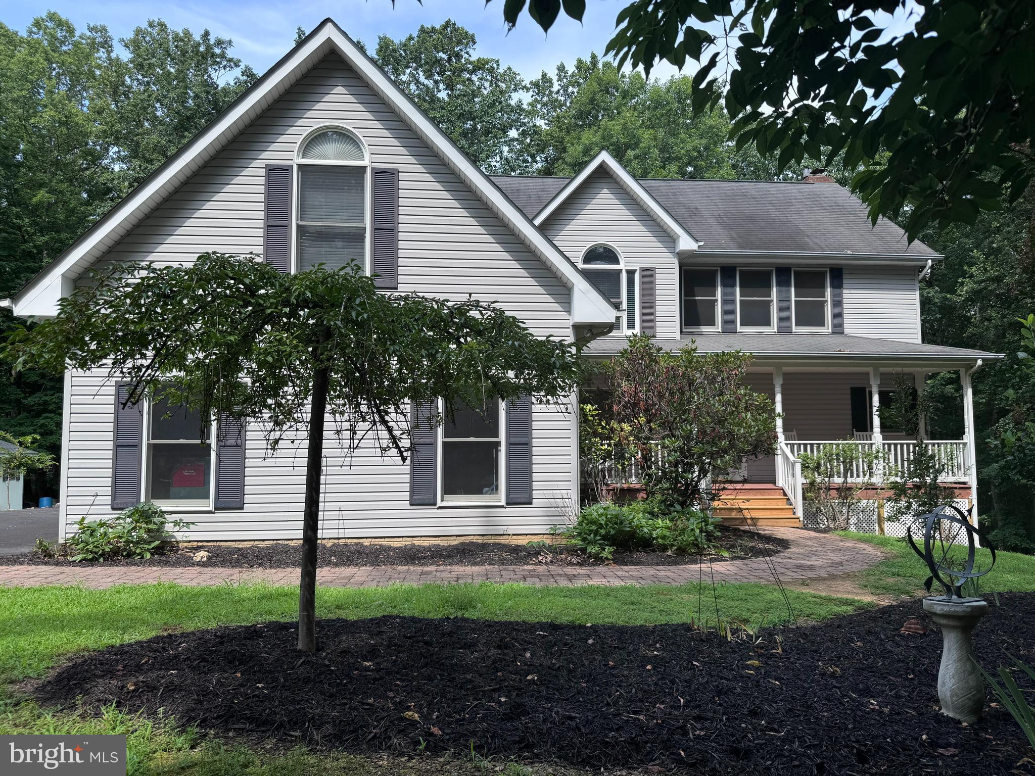 LOOKING FOR PEACE & TRANQUILITY?  Look no further than this beautiful Colonial with over 3,300SF of finished living space on 6.5 wooded acres in Quail Ridge Estates (no HOA!).  The home is located on a quiet cul de sac with close proximity to Warrenton/Culpeper/Sperryville.  Easy drive to Northern VA or work at home, Comcast is installed. As you drive down the paved driveway the woods open up to ample parking, an attached sideloading, heated, 2-car garage, and a beautifully landscaped yard with trails through the woods and a small creek at the back of the property.  The covered front porch offers a relaxing spot for your rocking chair and morning coffee.  Come inside to a welcoming 2-story foyer and an open concept living room and kitchen in the back of the house.  The living room features a cozy gas log fireplace and access to the screened-in back porch and grilling deck for outdoor entertaining.  Need more living space on the main floor, consider enclosing the back porch as a four-season sunroom. The kitchen boasts a large center island with bar seating, a breakfast nook, pantry cabinet, and a separate formal dining room.  A main-level laundry/mudroom off the kitchen and a powder bath complete the main floor.  Upstairs you will find a spacious primary bedroom, walk-in closet and a private bath boasting a soaking tub, shower, and double sink vanity.  Two additional bedrooms share the nice-sized hall bath with a double sink vanity and tub shower.  One of the bedrooms currently functions as an office, but don't miss the huge, finished bonus room over the garage!  Retreat to the fully finished walkout basement offering a recreation room, lots of storage, a rough-in for future bath, a coal stove for alternate heat, and access through the sliding glass doors to the backyard.  Recent improvements include new front steps, new decking in the rear, LVP flooring throughout the main living area and baths, updated lighting, painted whitewash finish on the kitchen cabinets and bath vanities.  Main HVAC unit was replaced 3 years ago (dual fuel heat pump with gas back-up), upper-level electric HVAC unit was replaced 5 years ago.  Other upgrades & conveyances include a radon system, whole-house surge protection, generator hook-up (small unit conveys), and a garden shed.  See the 3D interactive floorplan. Back porch photos are digitally staged for inspiration.