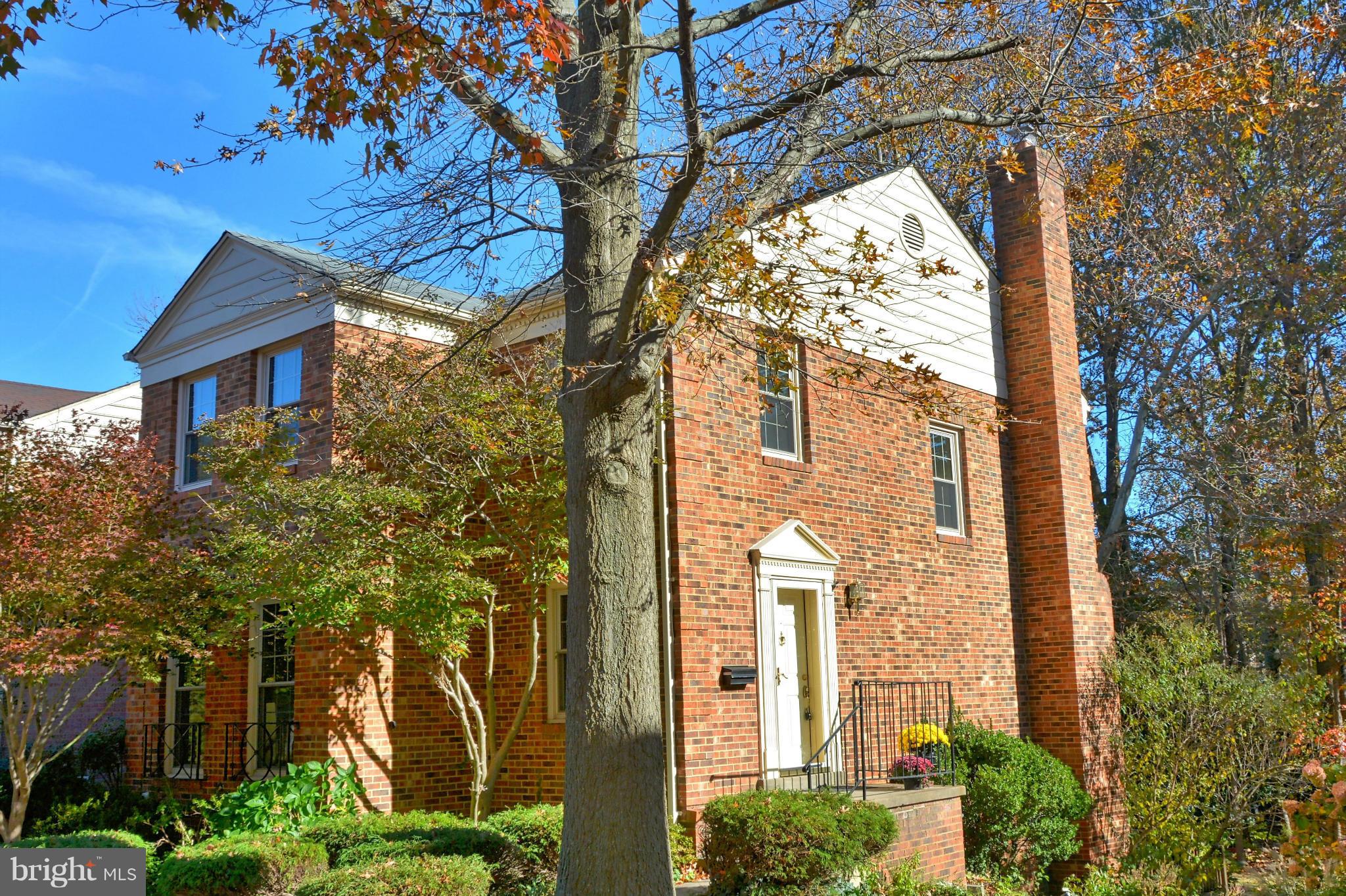 All Brick End Town Home. Charming kitchen with SS appliances & breakfast bar opens to FR with wood burning fireplace. Formal LR & DR. Lower lvl has 4th bedroom, full bath and rec room with beamed ceiling & wood burning fireplace + french doors that open to a large deck overlooking treed common area. 3 finished levels,4 Beds/3 1/2 baths. New paint and carpet, updated baths. Ample guest parking.