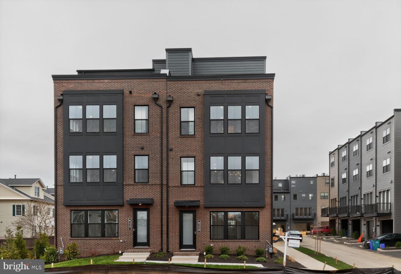 This stunning end-unit home is designed for effortless entertaining, featuring a bright, open main level with a spacious great room, dining area, and a beautifully appointed rear kitchen ready for your personal design selections.