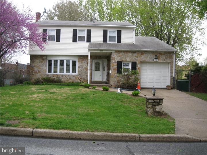!! East Torresdale!!!  Two story colonial style single. Home has been well maintained . Large living room, full dining room and large kitchen with breakfast bar. Family room with wood burning FPL and entrance to laundry room. Gigantic hall closet, powder room with hand painted custom vanity and entrance to garage.  SGD off the family room to extremely large deck and spacious rear yard. Second Floor features master bedroom with newly remodeled master bath, three additional bedrooms. Hall bath features cathedral ceiling with skylight over upgraded tub with power jets. Bonus room off the fourth bedroom that can be perfect office.sitting room or great storage.  All bedrooms have large closets. Lower level rec room recently upgraded and ready for your family play room (or man cave).  Central AC and forced hot air heat keeps the house comfortable year round.  All windows have been replaced.  Hardwood or wall to wall carpets and hardwood throughout. Seller providing AHS warranty.