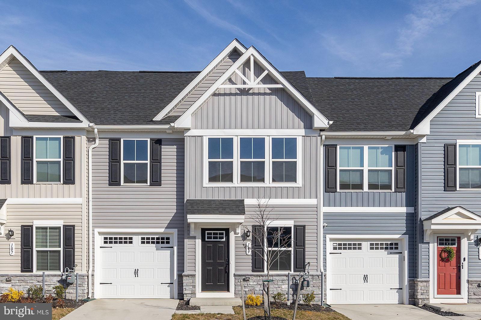 New home is located in the 55+ community of Winchester Landing. MAIN LEVEL BEDROOM! Primary suite with walk-in closet, carpeted bedroom, and tiled bathroom floor and shower. Kitchen complete with granite counters, stainless steel appliances, gas cooking, and island.  Luxury vinyl plank flooring throughout the remainder of the main level. Two additional bedrooms with carpet on the upper level as well as a second full bath.  Enjoy a one-car garage and a covered 11x11 outdoor living space. Fresh landscaping and front walkway.
