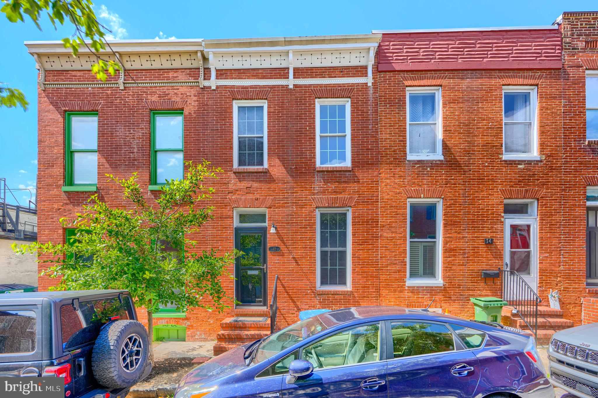 It is not often you can find a Federal Hill property in this price point with a PARKING space! Neat and neutral home with fresh paint throughout. Enter the home into the spacious living room with wood flooring and exposed brick then step into the kitchen with stainless steel appliances and side door breezeway access to the fenced rear yard. The second level features two bedrooms, full bath and access to the rear composite deck. Plenty of storage in the unfinished basement. Steps to Cross St market and other Federal Hill bars and restaurants.