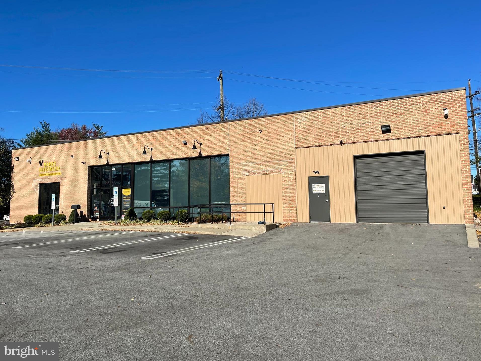 High visibility corner property. Approximately 5000 SF brick building.  Includes showroom, 6 offices, meeting room, 2 ADA restrooms, storage/warehouse space.  10'x10' overhead drive-in door.  Paved lit parking for 53 cars .