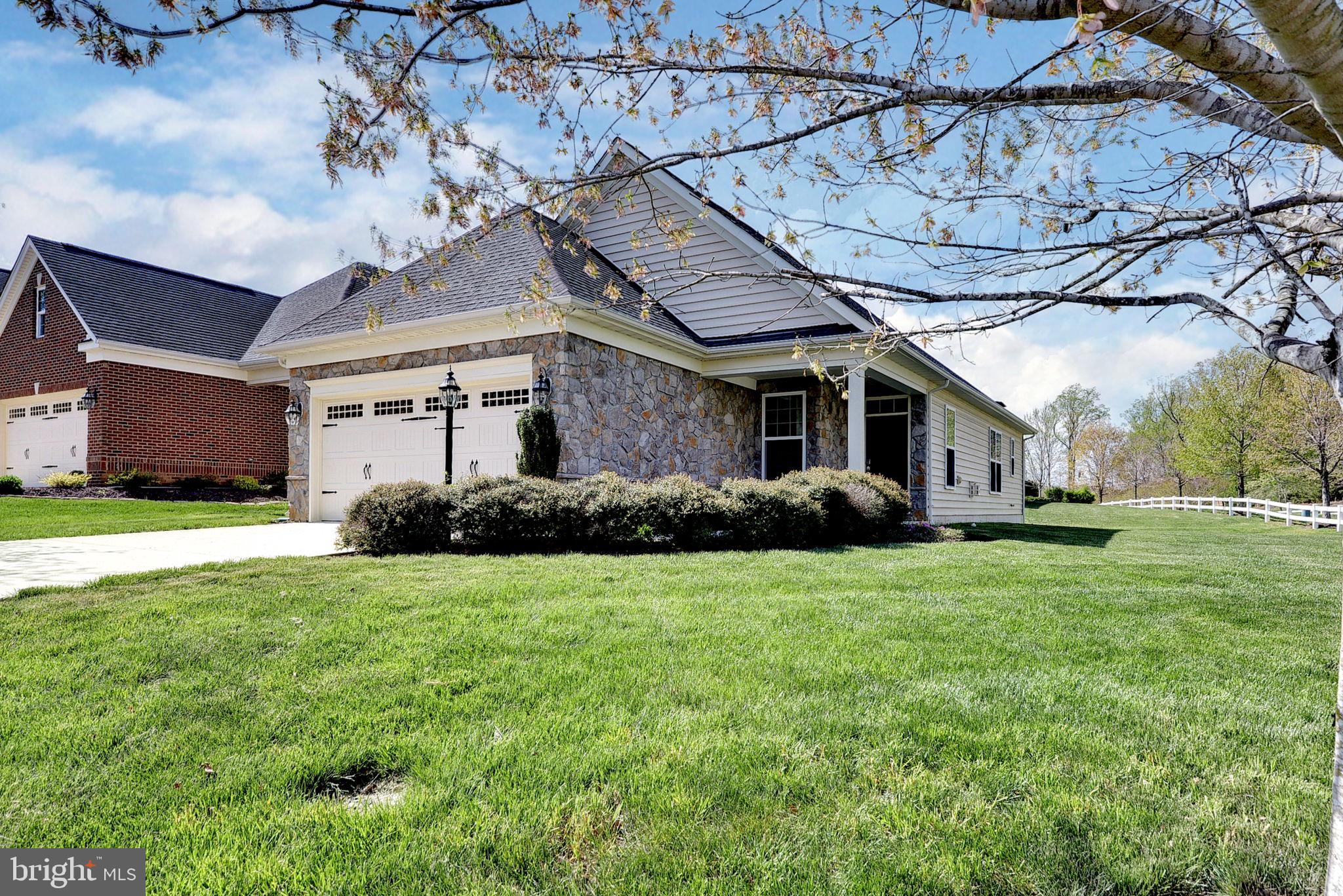 One level living at its finest with this adorable Belle Grove Cottage Series bungalow in the heart of Williamsburg’s Premier 55+ Gated Community, Colonial Heritage! Low maintenance and new luxury vinyl plank flooring throughout. Open concept with a gracious living room and dining room sharing a cozy gas fireplace. Lovely kitchen featuring stainless steel appliances and granite countertops. The sizable primary suite features two closets and dual vanities and an oversized shower. An additional bedroom shares another full bath. A private office and a laundry room leading to the two car garage and utility closet completes this fantastic floor plan! Enjoy the lovely corner lot from your private back porch with easy access to the neighborhood walking trails. Bright and airy, see this one first!