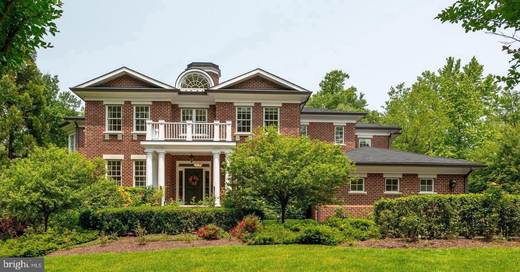 Now offered at $4,800,000, this stunning custom-built estate is nestled in the heart of Langley Forest, one of McLean's most prestigious and sought-after neighborhoods. A classic Georgian Revival exterior, built by Griffin/Moran, gives way to a strikingly modern interior—open, light-filled, and spacious throughout, with an expansive floor plan that feels fresh and contemporary behind its timeless façade. Featuring three dishwashers, multiple beverage stations, and exceptional indoor-outdoor entertaining spaces, this home was designed for effortless luxury living.

Sited on an enormous, flat, and private 0.8-acre lot, the residence offers over 9,700 square feet of thoughtfully designed living space, including 6 spacious bedrooms, 6 full bathrooms, and 3 half baths. The home features 10-foot ceilings, exceptional millwork, designer lighting, and custom-made built-ins, radiating crisp, sophisticated style throughout.

You are welcomed by a bright entrance foyer with cathedral ceilings, a graceful staircase, and a soaring chandelier that sets a stunning tone. The main level is perfectly tailored for everyday living and grand entertaining, anchored by a gourmet kitchen with a spacious pantry and large breakfast area, flowing seamlessly into an inviting family room with a gas fireplace and a grilling deck for effortless indoor-outdoor living. A private office with custom built-ins shares a two-sided gas fireplace with the formal living room, while the elegant dining room is complemented by a fully equipped butler's pantry featuring a third dishwasher and extensive custom cabinetry. A mudroom, three-car garage, and elevator shaft complete the level.

Upstairs, the primary suite is a true sanctuary, featuring a vaulted ceiling, sitting area, dual custom closets, and a spa-inspired bath with heated floors, a steam shower, and a gorgeous freestanding tub. For ultimate comfort and convenience, the suite also includes a private beverage and coffee station area, creating a luxurious retreat within the home. Three additional spacious en-suite bedrooms with full bathrooms—two featuring built-in desks and storage—along with an upper-level laundry room, complete the floor.

The fully finished walkout lower level stands apart with 9-foot ceilings, new flooring, a gas fireplace, multiple entertainment areas, full-size windows, and French doors that flood the space with natural light. Designed for entertaining, recreation, and extended-stay guests, it includes two additional bedroom suites, space for a home theater, gym, and wine cellar, as well as a beautifully appointed wet bar featuring custom cabinetry, a dishwasher, beverage refrigerator, and serving area.

Outdoors, professionally landscaped grounds create a peaceful, resort-like retreat. The garden showcases 60 David Austin English rose bushes alongside hydrangeas, clematis, and peonies for vibrant seasonal color. A pergola with an outdoor fireplace creates an inviting gathering space, while a separate outdoor dining area provides the perfect setting for elegant al fresco meals and entertaining. The exceptionally rare flat lawn offers ample room for a future pool, further enhancing the property's resort-style appeal.

Located just minutes from downtown McLean, Tysons Corner, top-rated schools, and major commuter routes, this exceptional estate offers a rare combination of privacy, luxury, timeless craftsmanship, and unbeatable value at its new price of $4.8M.
