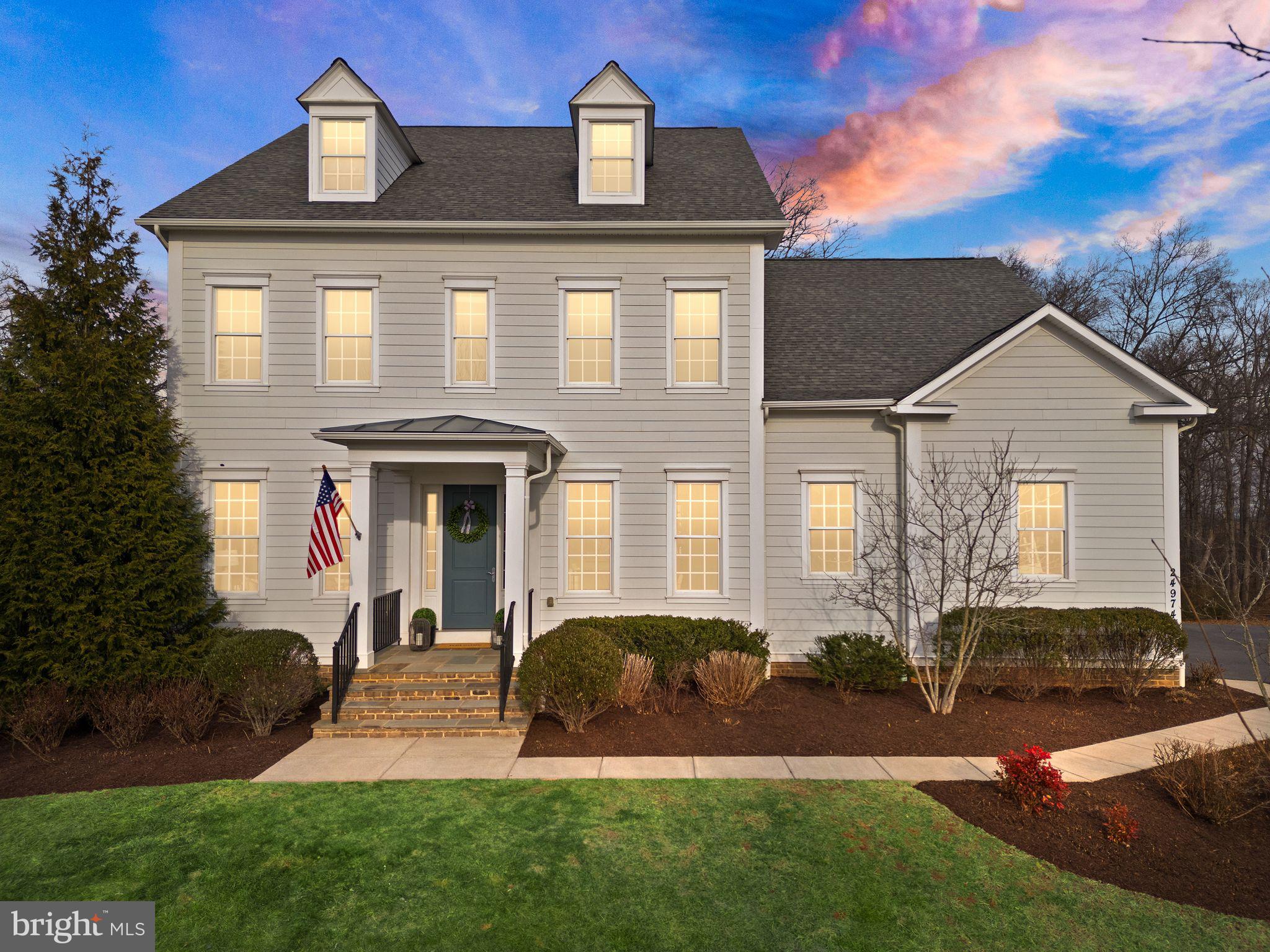 Welcome to award-winning Willowsford living at its finest. Nestled at the end of a quiet cul-de-sac in The Greens, this exceptional Durham model by Camberley Homes backs directly to the Willowsford Conservancy, offering breathtaking views, exceptional privacy, and a serene three quarter acre homesite. 
With over 6,500 square feet of thoughtfully designed living space, this freshly painted home features 8 bedrooms, 5.5 baths, and a rare attached in-law suite, ideal for multi-generational living, extended guests, or au pair accommodations. The private suite includes its own entrance, full kitchen with granite countertops and stainless steel appliances, a spacious living area, bedroom with closet, full bath with double vanities, washer and dryer, and a charming screened porch overlooking nature. 
The main residence welcomes you with gracious formal living and dining rooms, complemented by a butler’s pantry, custom walk-in pantry, and a mudroom. The gourmet kitchen is the heart of the home, showcasing white cabinetry, granite countertops, an expansive center island, six burner gas range, double ovens, stainless steel appliances, built-in desk, and a sunlit breakfast area with access to the deck. The adjoining family room is anchored by an impressive 10 foot custom stone wood burning fireplace, creating a warm yet dramatic focal point. A conveniently located half bathroom completes the main level. Hardwood floors grace the main level.
Upstairs, the luxurious primary suite offers a private sitting area, balcony overlooking the backyard, tray ceiling, dual walk-in closets, and a spa inspired bath with soaking tub, separate shower, and dual vanities. Four additional bedrooms, two full baths, and an laundry room complete the upper level. Brand new carpet adds comfort upstairs.
The walk-out lower level is an entertainer’s dream, featuring a full kitchen with quartz countertops and stainless steel appliances, a custom wood burning fireplace, two additional bedrooms including one with four custom built-in bunk beds, a full bathroom with a large walk in shower, a washer and dryer hookup, a home gym, storage, creative spaces including a Lego closet and display area, abundant natural light, recessed lighting, and LVP flooring.
Outdoor living shines with a gravel patio and retaining wall, all framed by peaceful conservancy views and an expansive, level backyard offering endless possibilities for outdoor entertainment and recreation, including ample space to accommodate a future pool and pool house with electrical already in place. A new roof adds peace of mind.   
Residents enjoy the top notch amenities of Willowsford, including The Lodge and Sycamore House, resort style pools, state of the art fitness centers, miles of trails, lakes and fishing ponds, parks, playgrounds, tot lots, bike trail swings, zip lines, outdoor volleyball court, sledding hill, dog parks, kayaking, and abundant green space throughout the community. Willowsford’s award-winning Agrihood sets it apart with a distinctive farm to table lifestyle anchored by Willowsford Farm, CSA programs, and farmstands. Willowsford Kitchen fosters a strong connection between residents and the land, offering adult and kids cooking classes, resident dinners, culinary programs, wine tastings, and pop-up restaurant nights. A wide variety of clubs and social groups create a vibrant sense of community, while children can participate in the Willowsford Waves summer swim team. Community events include spectacular Fourth of July fireworks, fall festivals, holiday celebrations, and year round activities for all ages. Schools are conveniently located within walking distance.
Built with durable two by six construction, this home offers quality rarely available in today’s market. The property is conveniently located 15 miles from Dulles International Airport.