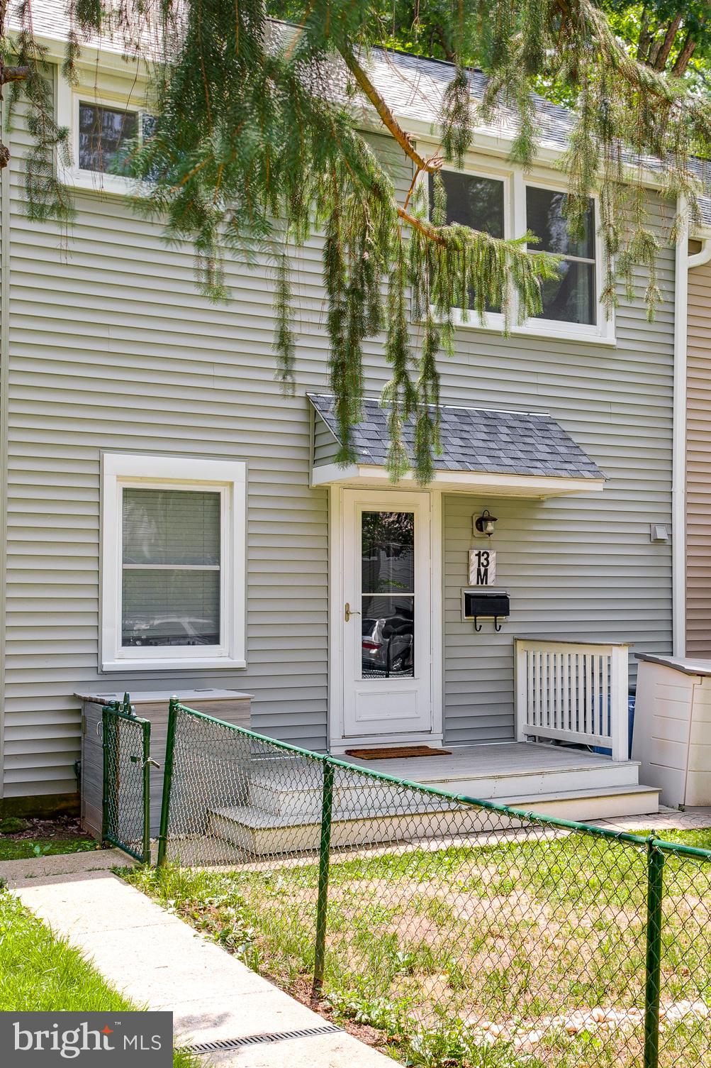 ***COZY, EFFICIENT, UPGRADED***  best describes this home.  Let's start with the charming fenced in front and rear yard, then to the UPDATED kitchen with stainless steel appliances and UPDATED flooring on the main level, with new carpet on the stairs, and the original hardwood floors on the upper level, there is also a full-size stackable washer and dryer.  The 13-M Unit also has One & a Half Baths, UPGRADED  Water Heater, HEAT PUMP, and CEILING FANS in the two bedrooms and family room. The upstairs has been meticulously maintained along with the ATTIC being improved, flooring for Storage and UPGRADED  insulation.  The roof, windows, and siding have been replaced along with the exterior insulation which has been UPGRADED and UPGRADED Soundproof Drywall.  Enjoy the large 18 x 20 rear deck and large shed.  Hurry, grab this opportunity to buy in Historic Greenbelt!***TO LEARN MORE GO TO - WWW.GHI.COOP****PROPERTY TAXRS are INCLUDED in the monthly COOP FEE***