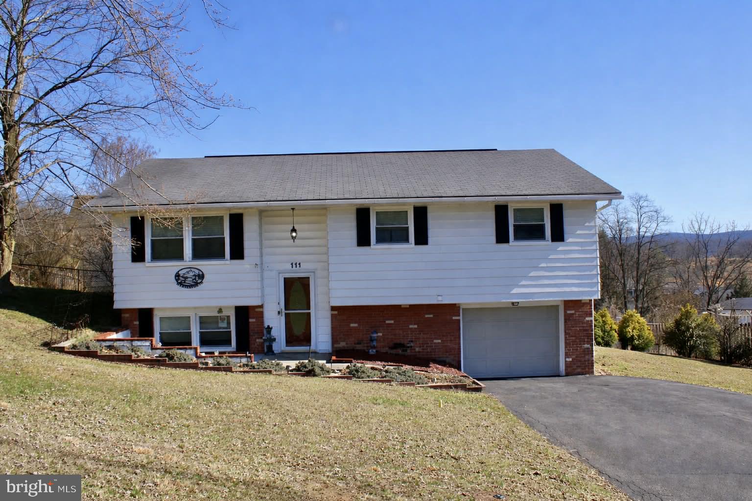 LOCATED IN POPULAR WEST SIDE ON A LOW TRAFFIC  STREET - THIS NICE SPLIT LEVEL FEATURES A LARGE LOWER LEVEL FAMILY ROOM - FORMAL DINING ROOM - NICE KITCHEN APPLIANCES - CENTRAL AIR - A BONUS ENCLOSED P ORCH OPENING TO A HUGE NEWER DECK WITH BEAUTIFUL MOUNTAIN VIEWS - ONE BEDROOM CURRENTLY USED AS A LAUNDRY AREA BUT CAN BE MOVED EASILY BACK TO BASEMENT AREA - 2 1/2 BATHS - NICE FENCED REAR YARD - AGAIN NICE MOUNTAIN VIEWS - DON'T MISS OUT ON THIS NICE HOME - SELLER NEEDS  TO FIND A SUITABLE APARTMENT - SMALL WORKSHOP AREA - STORAGE SHED.  DISCLAIMER SOME PHOTOS  AI  ENCHANCED