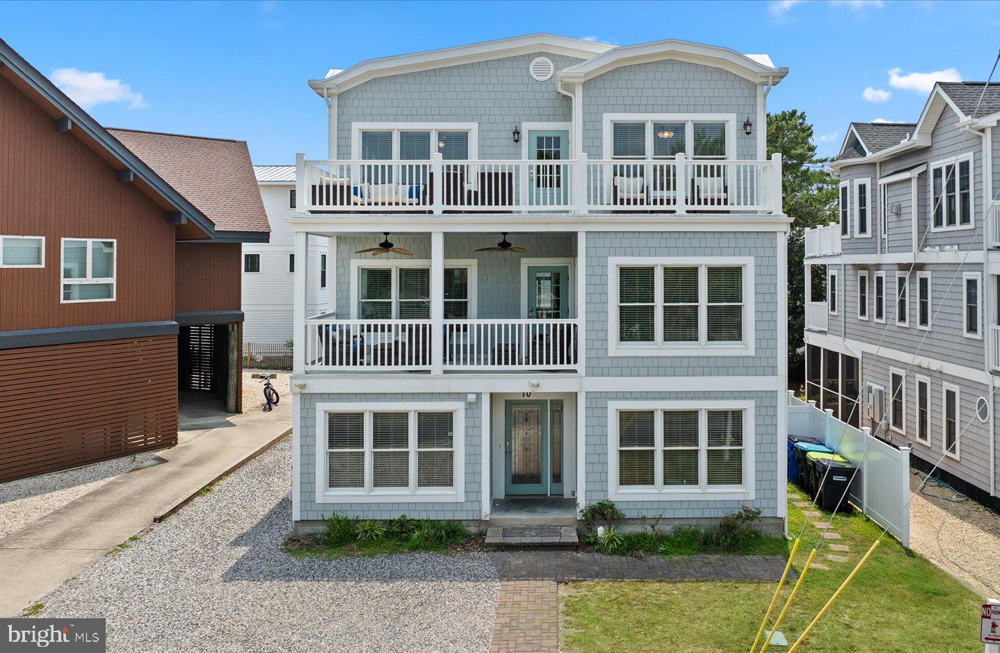Exceptional ocean-block living in Rehoboth by the Sea. Just three homes from the Atlantic Ocean and approximately 150 feet from the dune crossing, this expansive coastal retreat offers nine bedrooms, nine full baths, one half bath, and approximately 4,800 square feet designed for unforgettable gatherings at the beach. Located on the coveted north side of Dewey Beach in Rehoboth by the Sea, the home combines remarkable space, luxury amenities, and an unbeatable location just moments from both the ocean and downtown Rehoboth Beach. Thoughtfully designed across three levels and serviced by a private elevator, the home features an open floor plan with hardwood flooring, a spacious living room anchored by a gas fireplace, and multiple gathering spaces ideal for entertaining family and guests. The gourmet kitchen is equipped to accommodate a crowd with an oversized island, two dishwashers, Miele refrigerator and freezer, electric range, separate cooktop, wall oven, two microwaves, an additional refrigerator, and ice maker. The adjoining dining area and sunroom with ping pong and pool table create the perfect setting for entertaining after a day on the beach. The flexible floor plan includes five bedrooms and five-and-a-half baths on the entry level, a spacious main living level with an additional bedroom and full bath, and a third floor offering three ensuite bedrooms and a comfortable den. Multiple outdoor living spaces—including a covered front porch and expansive open deck—capture beautiful ocean views and refreshing sea breezes. Outside, enjoy your own private resort featuring an in-ground heated swimming pool, generous patio for lounging and entertaining, and an outdoor shower for rinsing off after the beach. Whether you're seeking an extraordinary family retreat, a premier investment property, or both, 10 Chicago Street offers a rare opportunity to own a spacious ocean-block home in one of Delaware's most sought-after beach communities, just steps from the sand and a short stroll to the restaurants, shops, and nightlife of Dewey Beach and Rehoboth Beach.
