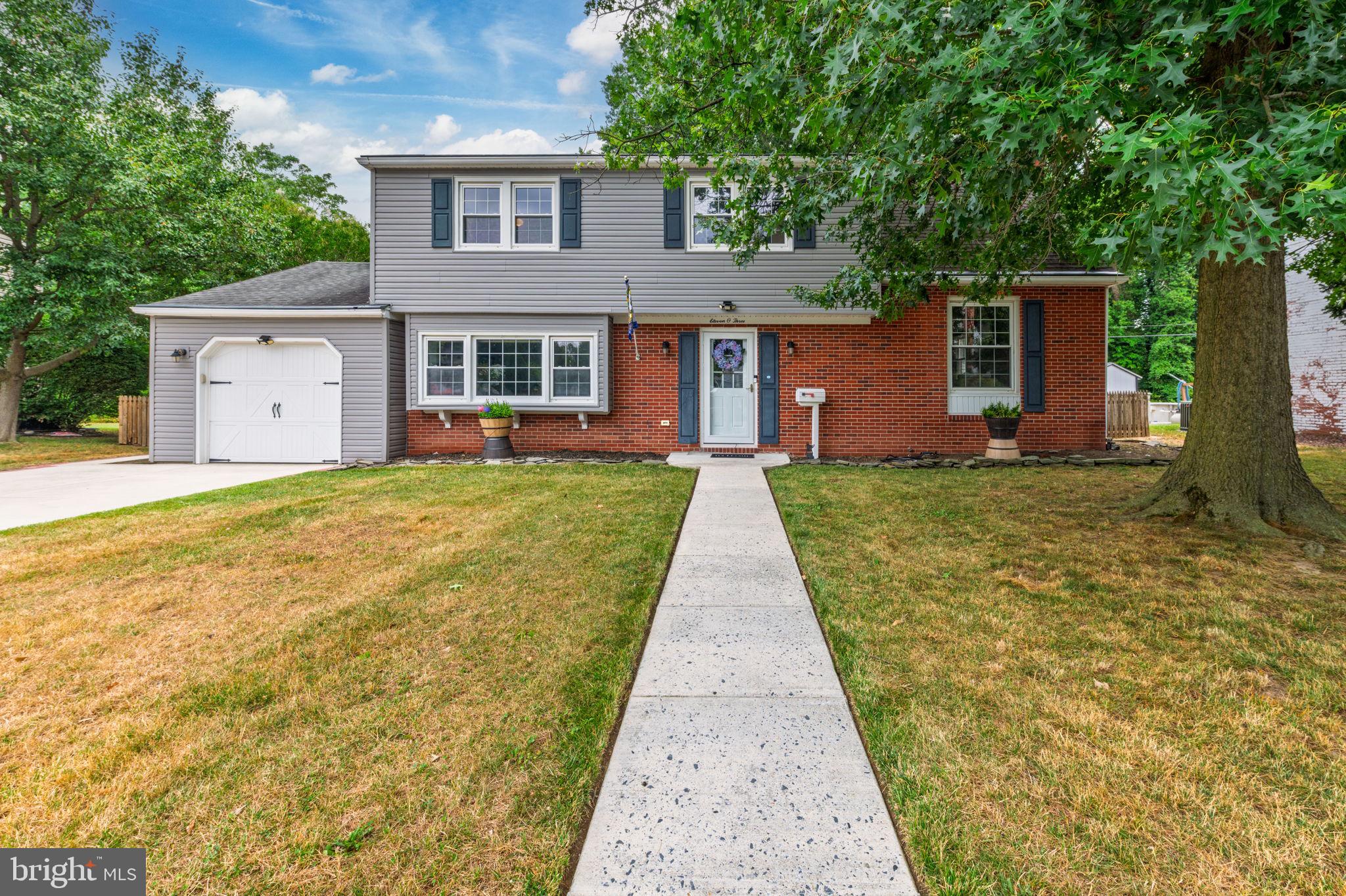 Some homes just feel comfortable the moment you walk through the door. This is one of them. Located in Dover's established Woodbrook neighborhood, this classic Colonial offers over 2,000 square feet with four bedrooms, two and a half baths, and the kind of floor plan that still works beautifully today. Whether you're hosting holidays in the formal dining room, enjoying movie night by the gas fireplace, or sipping your morning coffee in the sunroom, there's a space for just about everything. The home has been thoughtfully maintained and updated over the past few years. Since 2022, the sellers have refreshed much of the interior with paint and carpeting while also investing in important improvements including a tankless water heater, new HVAC system with humidifier, Nest thermostat, dishwasher, oven, Smart washer and dryer, battery-backup sump pump, and more. Outside, you'll find a fenced backyard with patio space for grilling, gardening, or letting pets play, along with an attached garage and driveway parking. Public water and sewer, no HOA, and a convenient Dover location close to shopping, restaurants, schools, commuter routes, and Dover Air Force Base make this home an excellent option for a variety of buyers, including those connected to the military community. Move in, settle in, and make it your own.