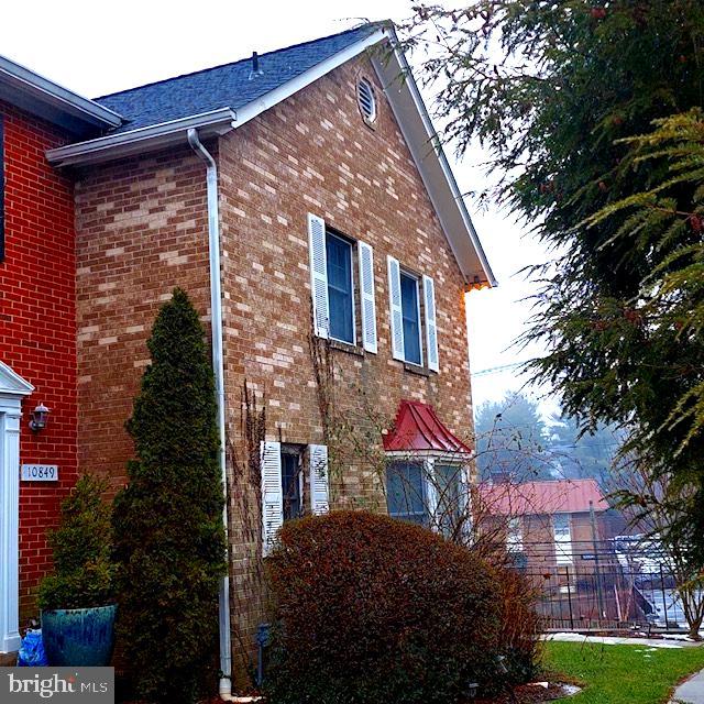 Stunning and rare end unit town home! Great location! HOA covers lawn maintenance.  Enter the home to a spacious foyer, powder room, large living room with wood burning  fire place, dining room, & large kitchen with granite, upgraded cabinets, & SS appliances. Gorgeous hardwood flooring throughout the main and upper levels. The upper level has a large primary suite with a full bathroom, double vanity with quartz countertop, gorgeous marble tile in the tub/shower and floor. Two more spacious bedrooms and a full bathroom in the hallway. The lower level has a spacious family room with hardwood flooring, wood burning fire place, & a slider door walkout to a cozy fenced rear yard with paver patio area with a Pergola.  Separate laundry room with extra space and a separate bonus room with vinyl plank flooring , closet,  and a small window.  Super close to major commuter routes.