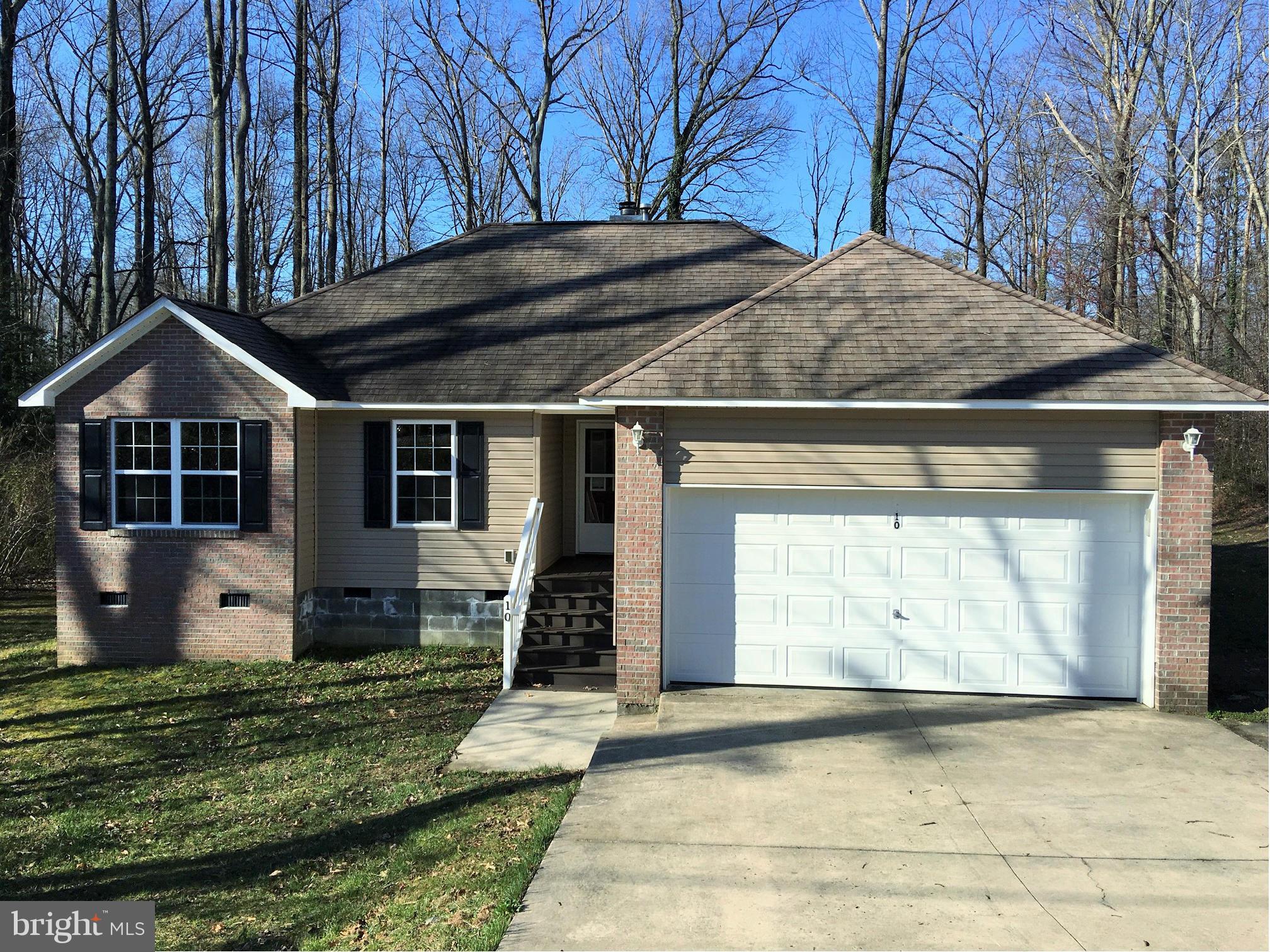 Newly Updated Brick Front Rambler. Turn Key...Just Move In! Parcel 8B-B- -55 also conveys giving you 1 Acre of land. Large Circular Driveway and 2-car Garage give you plenty of space for parking. Spacious family room with cozy fireplace. Kitchen with separate breakfast area. Like New Stainless Appliances. Deck and Front Porch.