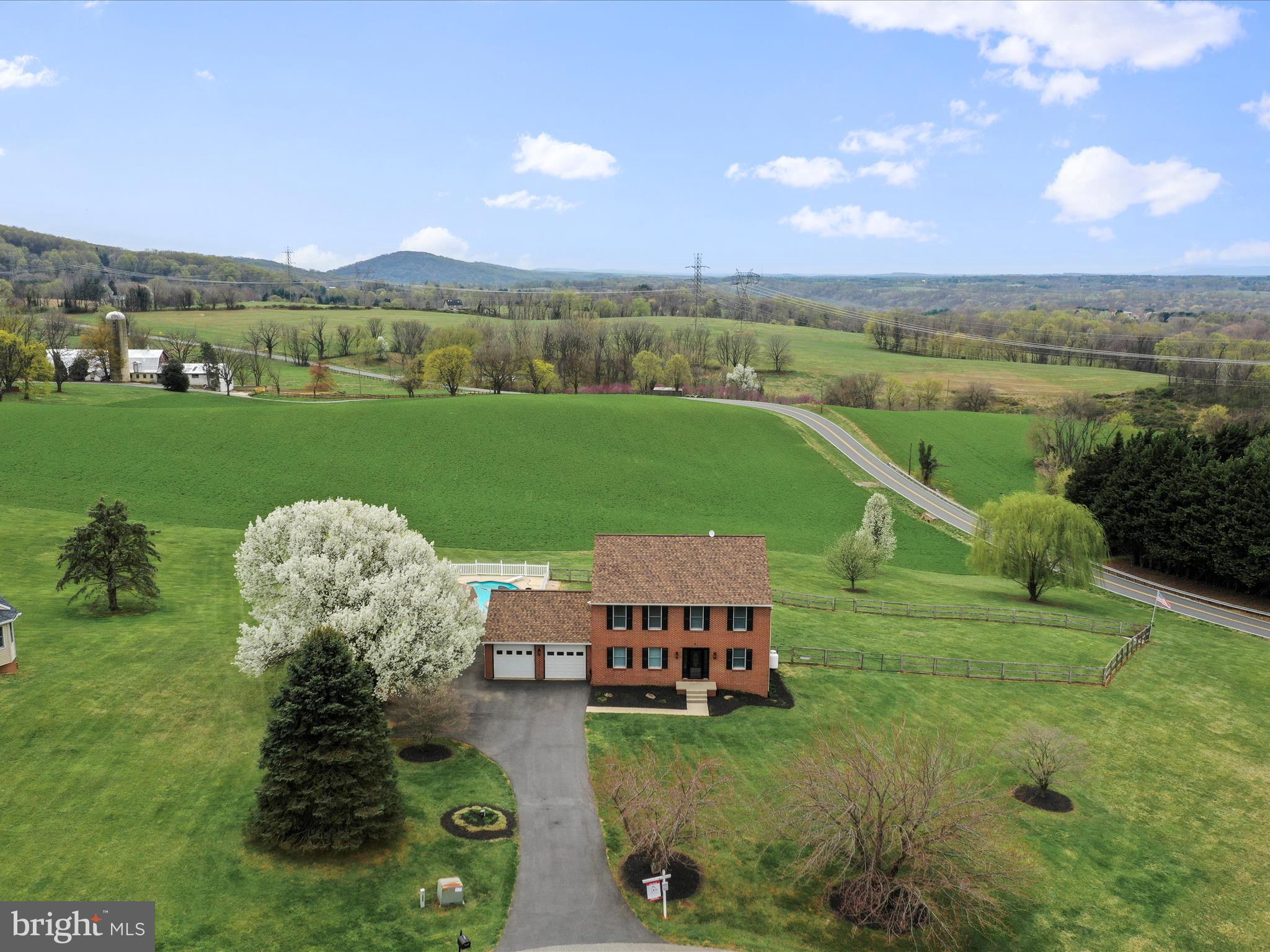 ***GET YOUR SWIMSUIT READY AND DIVE RIGHT INTO THIS HEATED INGROUND POOL***

Brick-front colonial nestled on 1.56 acres with breathtaking views! Mountains and pastures in every direction. This spacious 4-bedroom, 3.5-bath home offers the perfect blend of comfort, style, and function—ideal for both everyday living and entertaining. Step inside to find a beautifully updated interior featuring a custom kitchen with a large island, cherry cabinets and granite countertops and first floor office. The finished basement expands your living options with plenty of room for recreation or relaxation. The generously sized primary suite boasts a luxurious en-suite bath (2019) with modern finishes and custom shower door. Plush carpeting was replaced in 2019 and 2020, while key systems have been thoughtfully upgraded—including the HVAC (2023) and roof (2019)—providing peace of mind for years to come.  Step outside and enjoy your own backyard oasis, complete with composite decking, landscaping and a SunSetter awning—perfect for lounging or dining al fresco while soaking in the incredible views. Just in time for Spring/Summer, this home offers a heated in-ground pool, which was completely renovated in 2023. A completely new driveway installed (2023), large shed and attached 2-car garage add convenience, while the home’s location offers easy access to commuter routes and the MARC train. This is the one you've been waiting for—schedule your private tour today!