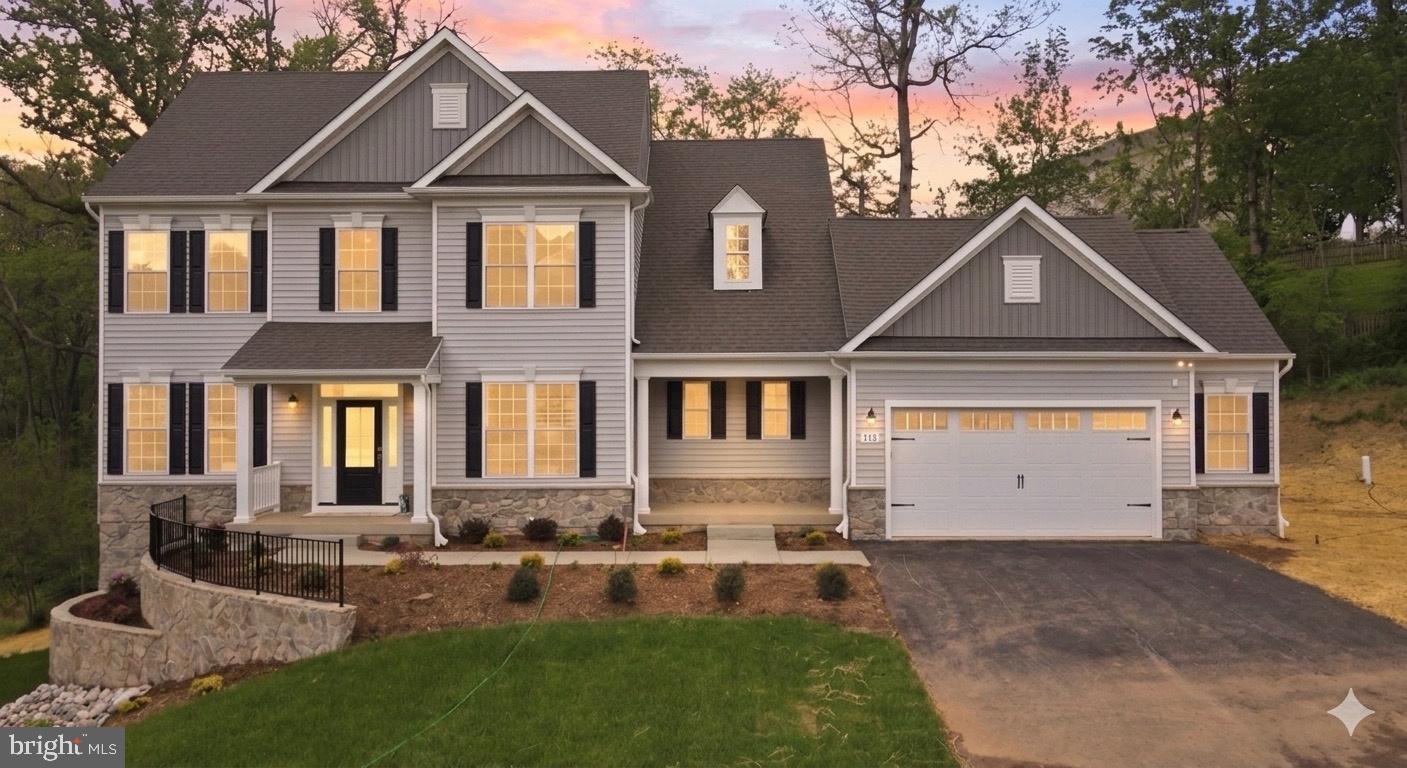 NEW CONSTRUCTION - MOVE IN READY: Over 3,600 square feet - Brand New Home by award-winning Forty West Builders. Stunning Colonial on the most desirable homesite in the community. The homesite is private, backing to forested parkland and includes a tranquil stream. Beautiful Oak stairs greet you as you enter the home. 9' ceilings on all levels, coffered ceiling & fireplace in the family room. The kitchen features upgraded cabinets, a large island, a double oven, a natural-gas cooktop, and quartz countertops. Upgraded wide-plank hardwood floors on the main level. The primary bedroom features a walk-in closet and a private spa-bath with a separate shower, soaking tub, and dual vanities. There is a bedroom-level laundry room. The large finished basement includes a full bathroom, a bedroom, a wet bar, and a large recreation room. Exterior upgraded to include two (2) porches, stone terraced landscaping, and a stone water table. The two-car garage includes a large 6-foot side extension that is perfect for a workshop and/or additional storage.