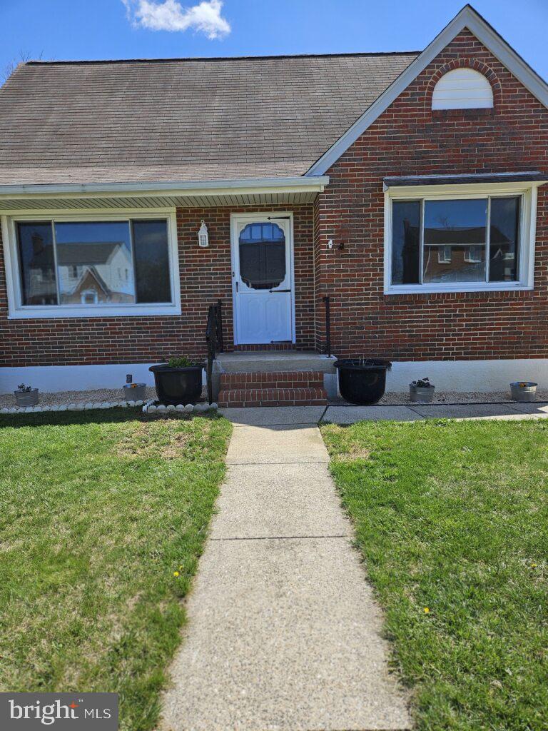 Step through the front door of this charming all brick home and be welcomed into the cozy living room, where natural light pours in thru the large bay window, highlighting the beautiful hardwood floors throughout the main level. A modern electric fireplace adds warmth and ambiance, making this the perfect spot to relax in winter months. The large screen tv over the fireplace stays with the sale. Fresh paint throughout gives the entire space a crisp, clean feel. The traditional floor plan includes a spacious dining room and eat-in kitchen with a new granite countertop, a recently replaced refrigerator, and gas stove– perfect for the home chef.  A bedroom on the main level has a nice view of the tranquil backyard, plus a full bath with updated vanity and a walk-in tub (being sold as is).
Upstairs, you'll find two additional bedrooms with ample space and another half-bath. On the lower level- there’s a finished basement with new carpeting and a corner gas fireplace on one side, plus vinyl flooring on the utility side, another half-bath, and direct access to the backyard. The backyard is a gardener’s delight, with fresh soil to plant your favorite things within the 6-foot privacy fence. Plus, a fire pit and outdoor lights for entertainment.

The detached garage is equipped with electricity, an extra refrigerator, and ample parking space in the gated driveway. There’s also a whole-house generator (being sold "as-is," needs a new battery) which adds an extra layer of peace of mind.

This home is situated in a quiet neighborhood with easy access to 95 and Baltimore City. It offers 3 bedrooms, 1 full bath, and 2 half baths, along with a ONE YEAR HOME WARRANTY, ensuring stress-free living for a full year. Don’t miss out on the opportunity to make this inviting, well-maintained home yours!