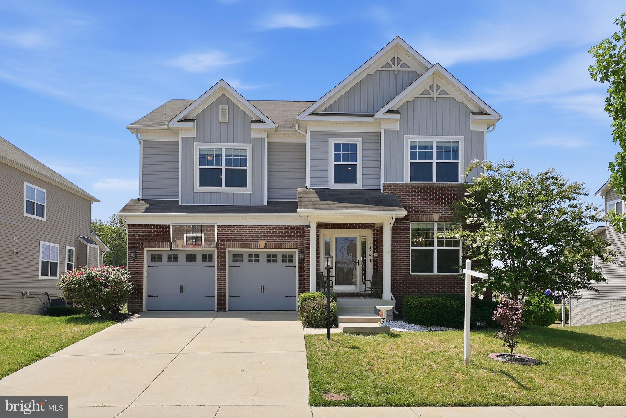 Welcome to 11286 Saint Christopher Drive — nearly 5,000 square feet of thoughtfully designed living space in one of White Plains' most sought-after communities, and a rare opportunity to own a home that truly does it all.

From the moment you arrive, the stately colonial exterior, manicured landscaping, and inviting front porch set the tone for what's inside. Step through the door and you're greeted by soaring ceilings, crown molding, luxury finishes, and an open, light-filled floor plan built for both everyday comfort and elevated entertaining. The chef's kitchen impresses with granite countertops, a large island, breakfast bar, double oven, and stainless steel appliances — all flowing seamlessly into the main living area anchored by a cozy fireplace.

What truly sets this home apart is its unmatched flexibility across three finished levels. The main level features a primary bedroom suite with its own full bath — ideal for guests, in-laws, or anyone who needs single-floor living without compromise. 

Upstairs, the expansive primary suite is a true retreat, complete with a walk-in closet, spa-style soaking tub, walk-in shower, and double vanity. Three additional upper-level bedrooms — each with ceiling fans — offer generous space for family or flex use.

The fully finished walkout basement is a home within a home. Featuring a wet bar with granite counters, a full bath, a fifth bedroom, and direct exterior access, it's perfectly configured as a second living suite, multigenerational space, or mother-in-law quarters — a setup that's increasingly hard to find and nearly impossible to replicate at this price point.

Additional highlights include a two-car attached garage, a rear deck with a fabulous view, 2016 construction with modern systems throughout, and a $90/month HOA in the desirable Gleneagles South/St. Charles community — offering neighborhood amenities without the headache.

At $131/sq ft for nearly 5,000 finished square feet, the value here is clear. With current market conditions, homes of this size, quality, and versatility rarely stay available long! 11286 Saint Christopher Drive isn't just a home — it's a lifestyle upgrade, a multigenerational solution, and a smart buy for today's market.