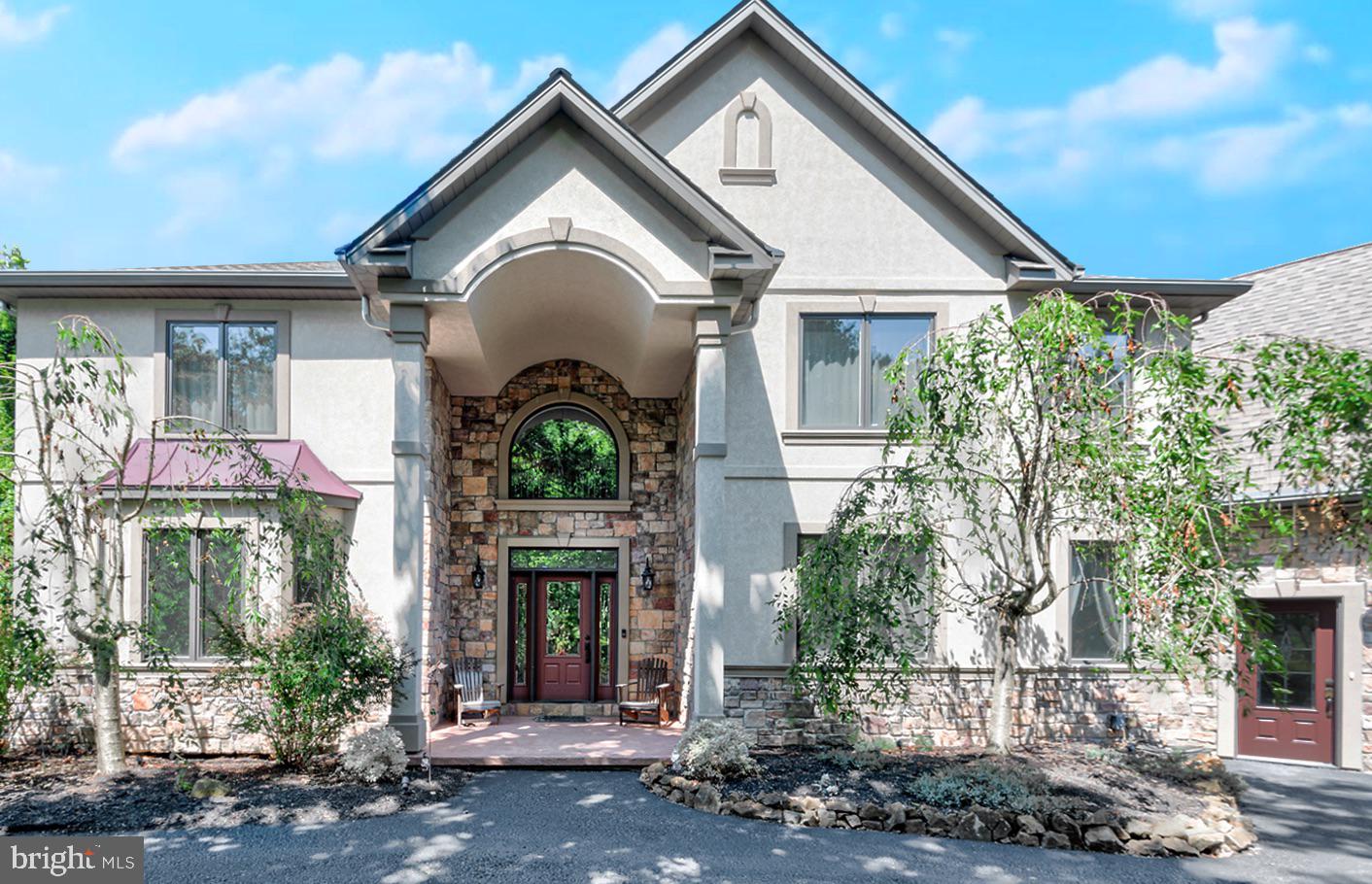 Absolutely stunning quality craftsmanship defines this exceptional custom-built home situated on a 1.22-acre wooded lot with the opportunity to purchase the adjoining 1-acre lot. Dramatic 2 story foyer leads to a spacious Great Room with soaring 20 FT ceilings. The Great Room, Bar/Game area and Kitchen areas feature an open concept design. Every room, every space, feels welcoming and appropriate, whether for family gatherings and activities, entertaining friends, or simply a quiet evening at home. The large 2 story Great room offers a beautiful open light-filled room with a beautiful 2 story stone fireplace to gather around. The oversized kitchen has been well planned for cooking and entertaining. Many extras with custom hood, solid wood cabinets with rollout draws, wall oven, 5 burner gas cooktop and an island make it a joy to create your fantastic meals. The formal dining room with tray ceiling, chair and picture framing molding allow seating for many without feeling cramped. A large private office is to the right of the foyer which could be used as an additional living room. A convenient laundry/mudroom completes the expansive first floor.  The main floor has 9-foot ceilings, laminate hardwood floors, rounded drywall corners, Pella windows and doors. The kitchen and game area both have access to the rear deck that overlooks a nice mature wooded lot. The expansive Upper Level has 4 large bedrooms. Primary bedroom suite has a large walk-in closet, owner spa bath w/ dual vanity,  tile shower & stand-alone soaker tub. One bedroom has its own private bath and the other two bedrooms share a Jack-n-Jill bath. The attached oversized 4 car garage is magnified with a half bath and walkup stairs to 650 sq.ft. of standup storage. The lower level is partially finished complete with an exercise room & electric fireplace, full bath, and additional room to use as you please. A home of this caliber also includes central vac, central sound inside and outside, security and a 400 AMP electrical system. An additional 28 x 46 detached building plays host to a home office, conference room, half bath,  kitchenette with mini-splits for Heat & A/C, and an additional oversized 1 car garage. The possibilities are endless with this additional space.  Need more garage space for your ”toys” or workshop this property has it all!  Tucked away in a quiet, serene setting but near Ski Roundtop Mountain Resort, Pinchot state park, and major highways. An absolute pleasure to show!