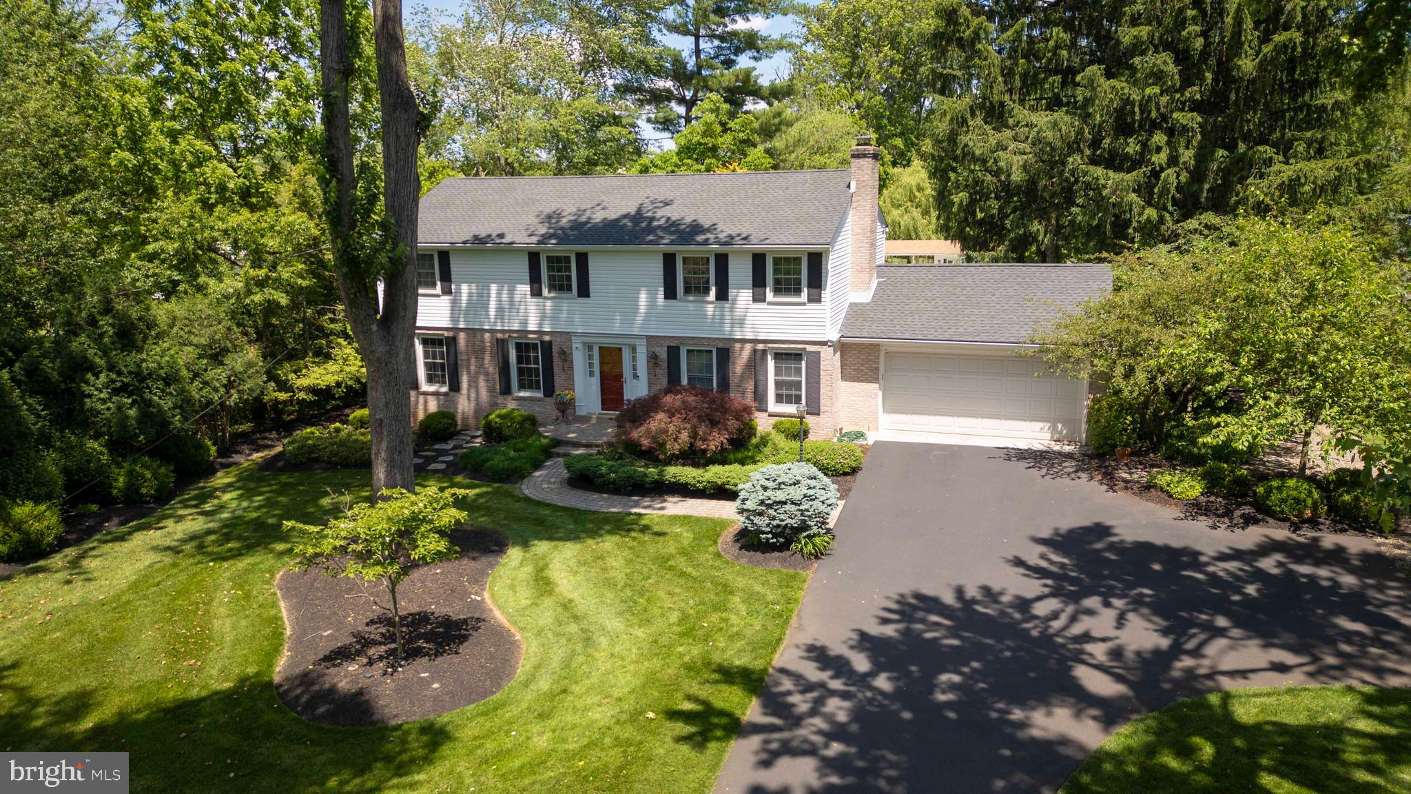 Nestled within a picturesque neighborhood framed by mature trees and timeless curb appeal, this beautifully updated home offers the perfect blend of warmth, thoughtful design, and exceptional indoor-outdoor living. From the moment you arrive, the welcoming entrance and manicured setting create an immediate sense of home, while inside, pristine hardwood flooring, neutral tones, custom millwork, and thoughtfully designed spaces showcase the care and investment poured into every inch of the property.
The main level was designed for both everyday comfort and effortless entertaining. The spacious Living Room flows seamlessly into the elegant Dining Room featuring custom built-ins ideal for storing china, glassware, and serving pieces. At the heart of the home, the updated Kitchen offers high-end cabinetry, granite countertops, recessed lighting, and a sunlit breakfast nook—all perfectly positioned to overlook the vacation-worthy rear yard, where the heated pool, pool house, and beautifully manicured grounds create a backdrop that feels more like a weekend getaway than everyday life. Just beyond, the Family Room feels both sophisticated and inviting with custom built-in cabinetry flanking a wood-burning fireplace. Sliding doors extend the living space outdoors to a rear deck and screened porch, creating the ideal setting for al fresco dining, relaxed evenings, and effortless entertaining. The outdoor living experience is truly exceptional. Set on .81 acres of meticulously landscaped grounds with specimen trees, lush greenery, and expansive lawn areas, the rear yard feels like a private retreat. The heated in-ground pool and pool house create the kind of setting that may have you rethinking those annual trips to the shore. Whether hosting poolside gatherings, enjoying morning coffee overlooking the grounds, or unwinding on the screened porch after a long day, every element of the outdoor space has been thoughtfully designed for relaxation and enjoyment. Additional conveniences continue throughout the home, including an organized Laundry Room with powder room access and direct entry to the oversized two-car garage featuring extensive shelving, storage solutions, and an epoxy-coated floor. Upstairs, the spacious Primary Suite offers a walk-in closet with a custom organization system and an updated ensuite bath featuring a dual vanity and walk-in shower. Three additional bedrooms provide generous dimensions and excellent closet space, while the finished lower level adds approximately 800 square feet of additional living space. Designed for entertaining and recreation, the lower level includes a dry bar, wine storage, beverage refrigerator, expansive counter space, room for game-day gatherings, and a dedicated fitness area. Positioned within the highly regarded North Penn School District and offering convenient access to Routes 202, 309, and the Pennsylvania Turnpike, daily commuting and travel are remarkably convenient. Nearby shopping, dining, and everyday conveniences—including Wegmans just minutes away—add to the lifestyle appeal, while the future Penn Medicine Montgomeryville campus represents one of the area's most significant long-term investments, bringing continued growth and positive momentum to the surrounding community. For buyers seeking more than simply a home, this property delivers a lifestyle. Combining thoughtful updates, exceptional entertaining spaces, resort-inspired outdoor amenities, and a location positioned for continued appreciation, this is a rare opportunity to enjoy the very best of home—without ever feeling the need to get away.