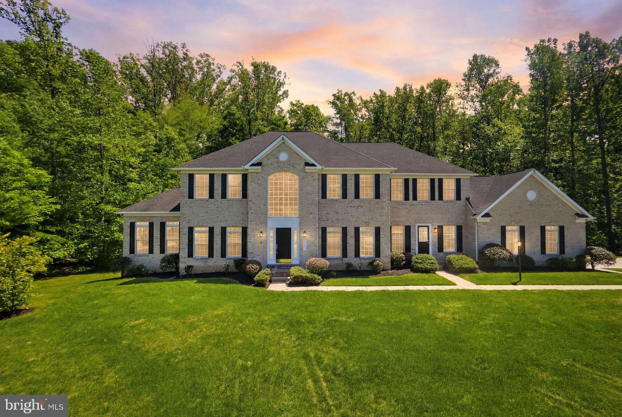 Welcome to 1801 Southwood Ct, an exceptional estate residence tucked away on a quiet cul-de-sac in the highly sought-after Woodmore South community. Perfectly positioned on a beautifully landscaped 1+ acre lot, this impressive brick-front Colonial offers the ideal combination of elegance, comfort, scale, and convenience with more than 7,000 square feet of finished living space across three expansive levels.

From the moment you arrive, the home makes a lasting impression with its stately curb appeal, grand proportions, and timeless architectural design. Inside, you are greeted by soaring ceilings, abundant natural light, and a thoughtfully designed floor plan that seamlessly blends sophisticated entertaining spaces with comfortable everyday living.

The main level features expansive living and dining rooms, ideal for hosting gatherings both large and intimate. At the heart of the home is a beautifully appointed kitchen designed for the modern lifestyle, complete with an oversized center island, generous cabinetry, ample prep space, and a spacious eat-in area perfect for casual dining and morning coffee. The kitchen opens effortlessly into the large family room, creating a warm and inviting atmosphere for entertaining and relaxing alike.

With 5 generously sized bedrooms and 3.5 bathrooms, this home offers exceptional flexibility and comfort for today’s evolving needs. The luxurious owner’s suite serves as a private retreat, offering expansive space, abundant natural light, and an ensuite bath designed for relaxation. The secondary bedrooms are equally spacious and well-appointed, providing comfort for family members and guests alike.

The fully finished lower level significantly expands the home’s functionality and versatility, offering endless possibilities for recreation, entertainment, fitness, media space, guest accommodations, or a home office setup. With over 7,000 finished square feet throughout the residence, there is truly room for everyone and every occasion.

Step outside and enjoy the privacy and tranquility of the oversized homesite, offering plenty of space for outdoor entertaining, recreation, or simply enjoying peaceful evenings surrounded by mature landscaping. The cul-de-sac location enhances both privacy and curb appeal while creating a quiet neighborhood setting.

Ideally located near Woodmore Towne Centre and Bowie Town Centre, residents enjoy convenient access to upscale shopping, dining, entertainment, grocery options, fitness centers, and everyday conveniences. Commuters will appreciate the home’s proximity to major routes, including Route 50, I-495, and the BW Parkway, providing convenient access to Washington, Annapolis, Northern Virginia, and surrounding employment centers.

This remarkable residence offers a rare opportunity to own a distinguished home in one of Bowie’s premier communities, where luxury, space, and location come together beautifully.