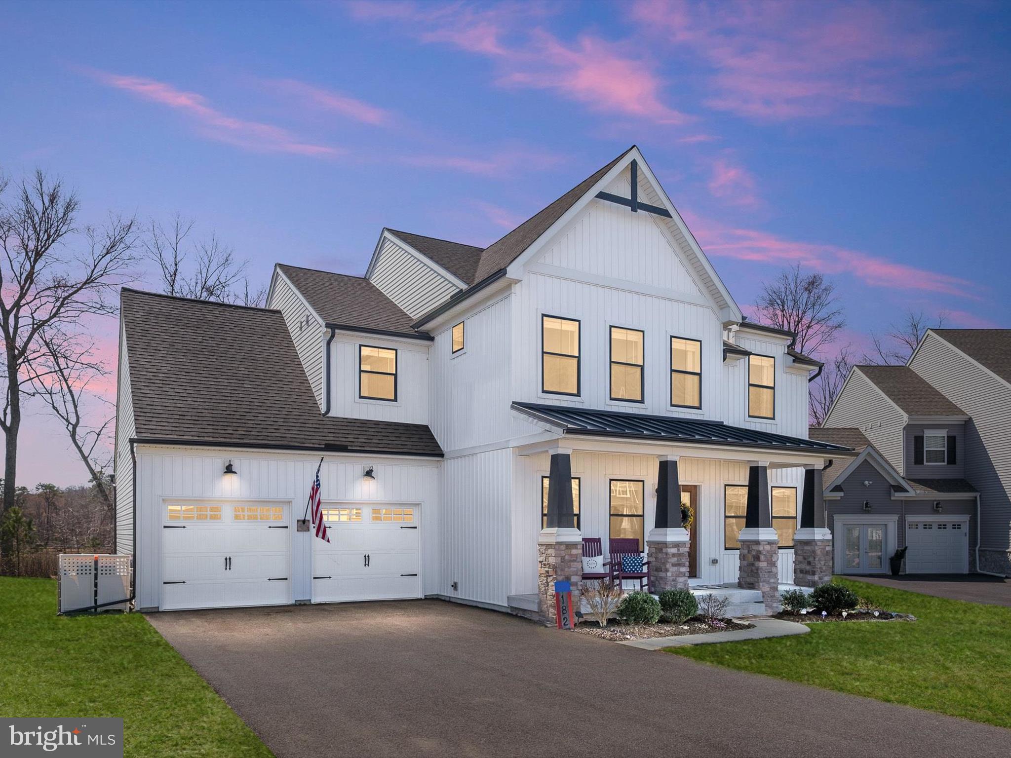 Welcome to this exquisite 4-bedroom, 2.5-bath contemporary farmhouse, perfectly nestled on a peaceful cul-de-sac. From the moment you arrive, the covered front porch invites you to step inside and experience the exceptional craftsmanship and thoughtful design throughout. The foyer, adorned with luxury vinyl plank flooring, a contemporary color palette, a modern lighting package and custom coffered millwork, sets the stage for the elegance within. A sliding barn door opens to the stylish living room, which features a coffered accent wall, while the sunlit dining area across the hall exudes charm and sophistication with its own coffered detailing. A well-appointed butler’s pantry provides additional storage, display cabinetry, a granite countertop, and a built-in microwave, optimizing kitchen space. The gourmet eat-in kitchen showcases stainless steel appliances, a designer backsplash, granite countertops, a gas range with a downdraft hood, soft-close cabinetry, and an expansive 8-foot center island with a farmhouse sink—perfect for culinary creations and gatherings. The adjacent breakfast area, bathed in natural light and enhanced with custom millwork, is ideal for casual dining. Flowing seamlessly from the kitchen, the inviting family room features a gas fireplace with a rustic rough-hewn mantel, while sliding barn doors and glass sliders offer picturesque views of the beautifully landscaped backyard. Step outside to enjoy the stamped concrete patio, a fantastic space for entertaining and outdoor dining. The main level also includes a stylish powder room, a mudroom, and convenient access to the two-car garage. Upstairs, the luxurious primary suite is a private retreat, complete with plush carpeting, two walk-in closets, and a spa-like en suite bath featuring a slipper tub, a frameless glass walk-in shower with dual showerheads, and a private water closet. Three additional spacious bedrooms—one with a walk-in closet—a full hall bath, and an upper-level laundry room complete the thoughtfully designed second floor. The full, unfinished basement offers endless potential to customize and expand your living space. Ideally located near historic Charlestown, Delaware, with easy access to I-95, this beautifully maintained home is the perfect blend of elegance, comfort, and convenience. It features several stylish custom updates, elevating it above the rest! Don’t miss your chance—schedule your showing today!