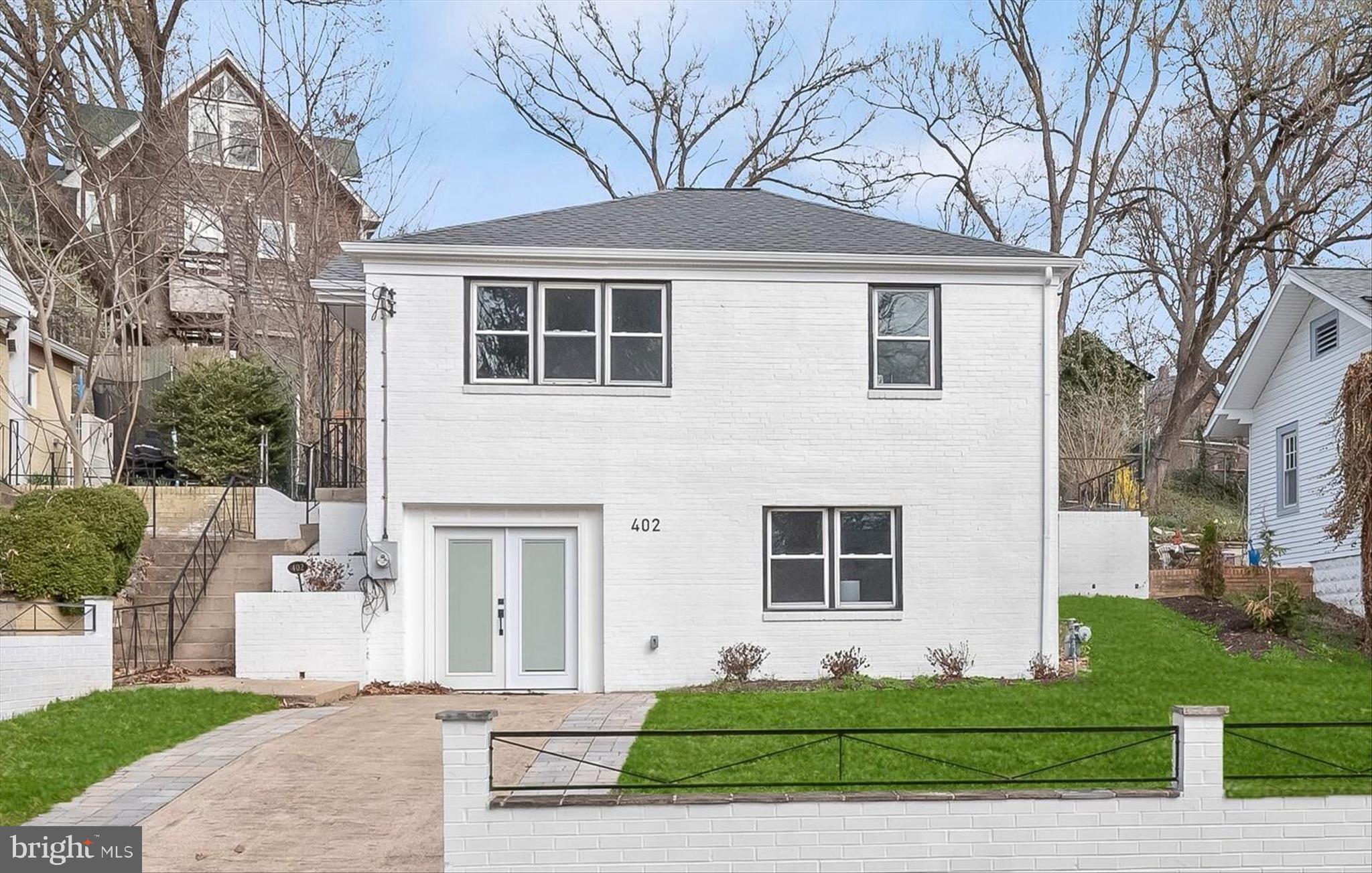 A rare chance to own a fully remodeled 2025 home in a prime location near Washington, DC, this standout property combines modern style with a vibrant neighborhood setting—ideal for those who want to live close to the city while enjoying a unique community feel. Thoughtfully curated with a modern aesthetic, the home showcases up-to-the-minute finishes throughout, including luxury vinyl flooring, new doors and hardware, two beautifully updated full baths, and a stunning white kitchen with quartz countertops, stainless steel appliances, and a stylish subway tile backsplash.
Outside, new pavers expand the driveway for additional parking, while a newly installed stone patio creates an inviting setting for outdoor living and alfresco dining. New windows, a roof replaced in 2025, and updated mechanical systems enhance comfort and efficiency.
Set in sought-after Takoma Park, this location offers a rich blend of natural beauty and urban convenience. Just 0.7 miles away, downtown Takoma Park features an eclectic mix of boutiques, vintage shops, restaurants, cafes, live music venues, and a popular farmers market that fosters a strong sense of community. The home is also conveniently close to the Arts District, adding even more culture, creativity, and entertainment to your doorstep.
Outdoor enthusiasts will appreciate the variety of nearby parks. Takoma-Piney Branch Local Park, approximately 1.2 miles away, includes basketball courts, playgrounds, a skate park, a dog park, picnic shelters, and fields for soccer and softball, along with art installations. Takoma Urban Park, only 0.8 miles away, offers a charming green space with a playground, gazebo, and bike racks. The Takoma Park Recreation Center, about 1.5 miles from the home, provides programs for all ages, including a gymnasium, meeting rooms, and fitness classes. Educational and cultural resources are also close by, including the Takoma Park Maryland Library and the Takoma Park Neighborhood Library, a branch of the DC Public Library.
Commuters will appreciate the proximity to the Takoma Metro Station on the Red Line, just 0.9 miles away, offering convenient access to Washington, DC and the surrounding metro area.
Priced strategically to create urgency among buyers, this home represents a fantastic value for such a beautifully updated property in a highly desirable location. With its combination of modern updates, prime setting, proximity to DC, and access to an array of amenities, 402 Elm Avenue presents a compelling opportunity to enjoy the very best of Takoma Park living.