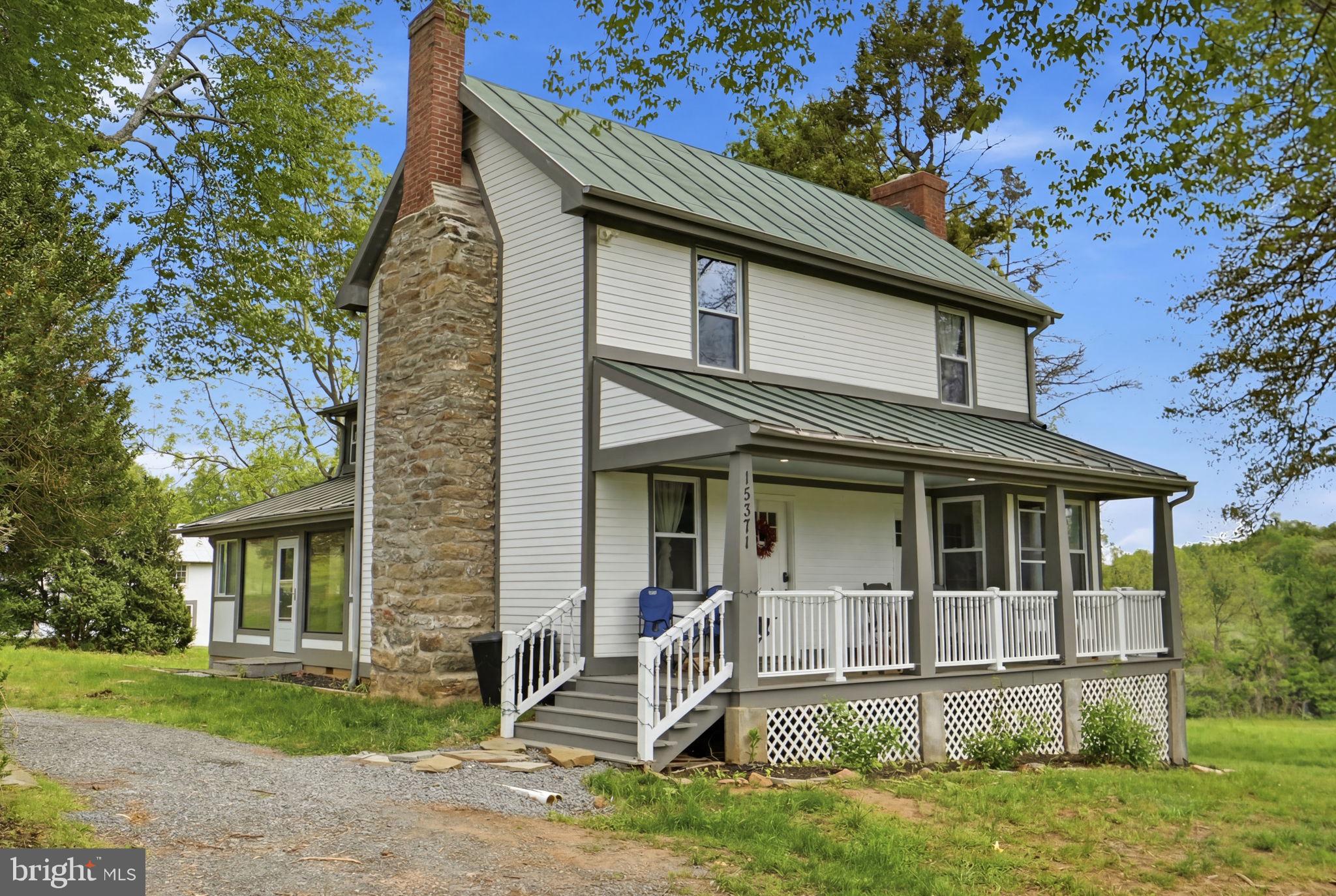 Timeless character, rich history, and modern comfort come together at 15371 Sheads Mountain Rd in Rixeyville, VA. Situated on 10.30 picturesque acres with a peaceful stream, this beautifully restored southern style farmhouse offers the rare opportunity to own a piece of Virginia countryside that has been thoughtfully updated while preserving the warmth and charm that make homes like this so special. Inside, you’ll find tasteful renovations including updated systems, fixtures, appliances, wiring, and HVAC, all carefully integrated to enhance everyday living without taking away from the home’s original character. The kitchen and bathrooms provide the convenience and functionality today’s buyers expect, while the home still showcases the inviting atmosphere and craftsmanship of a classic farmhouse. Outdoor living is equally impressive with multiple porches, including a spacious three-season porch perfect for entertaining, relaxing, or simply taking in the beauty of the surrounding landscape. A large two-level workshop/shed with power and updated lighting adds incredible flexibility for hobbies, storage, or workspace needs. With scenic acreage, mature surroundings, and a setting that feels both private and welcoming, this is the kind of property that rarely comes available. A truly special countryside retreat with history, charm, and usability all in one.