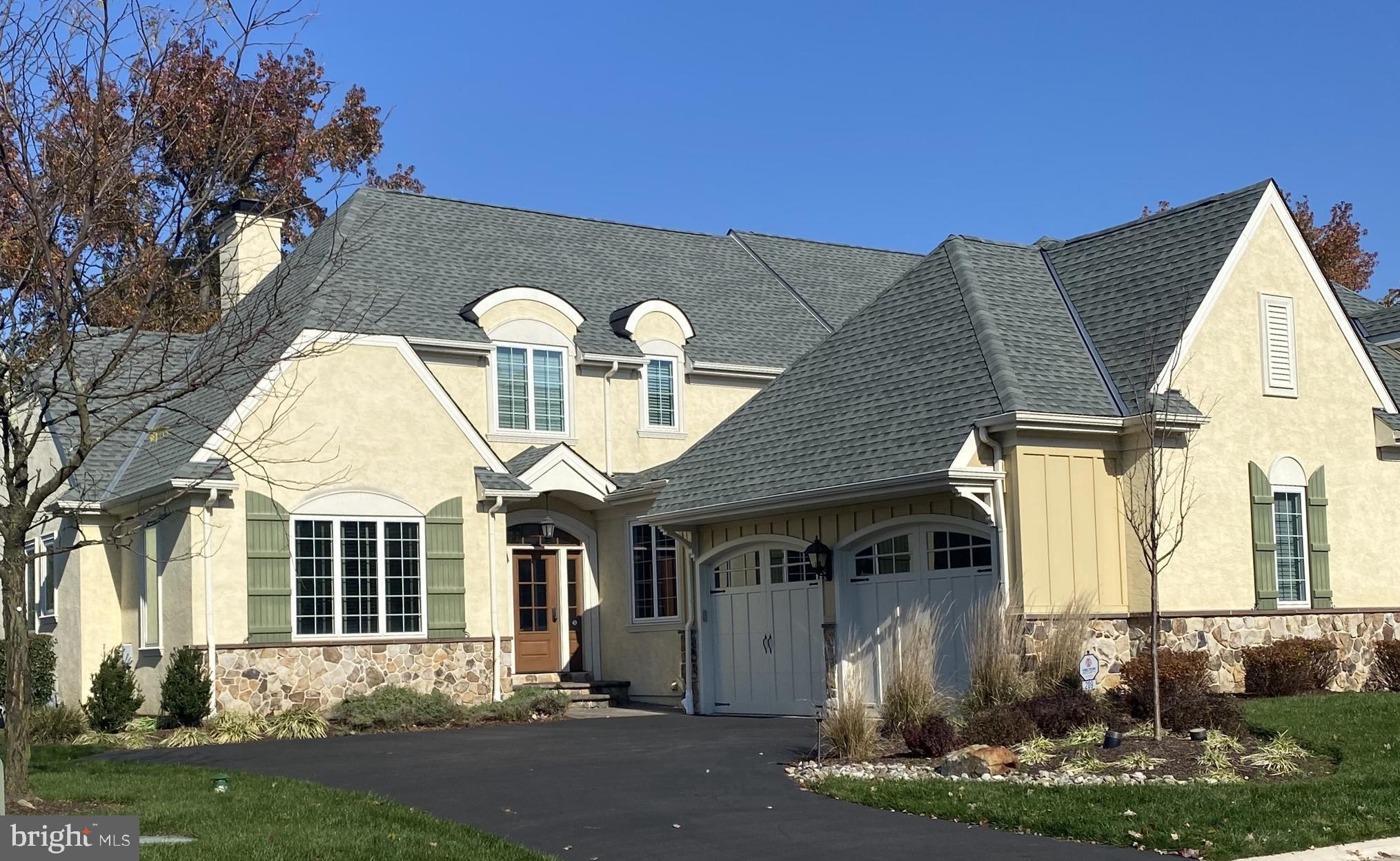 If you enjoy natural light glistening through your main living space, you should check out this cheerful, luxury home in the Haverford Reserve.  This stunning “Hudson” model has a very smart floor plan that maximizes the use of the space and delivers nearly 4,000 sq ft of finished living space.  The gourmet Kitchen flows into a vaulted Great Room and out to a private patio and flat backyard. The Kitchen and Dining Room enjoy a lovely Butler’s Pantry in between. The home has a neutral palette, so you can easily make design choices to allow your personality to shine through.  Although, it is so gorgeous that you might not want to change a thing!
With the Main Bedroom suite and handsome Home Office on the first floor, you can enjoy single level living when desired and expand into the additional bedrooms, both upstairs and in the Lower Level when you have friends and family with you.  In addition to a Bedroom and full Bathroom, the Lower level has a cool movie (or game day) room, a home gym and plenty of storage.
Additional features that you will appreciate in this lovingly well-maintained home are a full house generator and designer fixtures and finishes throughout.
The Haverford Reserve is a community of 100 luxury carriage homes located in the heart of the Main Line amidst 124 acres of preserved land, walking and bike trails.  There is easy access to Philadelphia and New York City via highway or train.