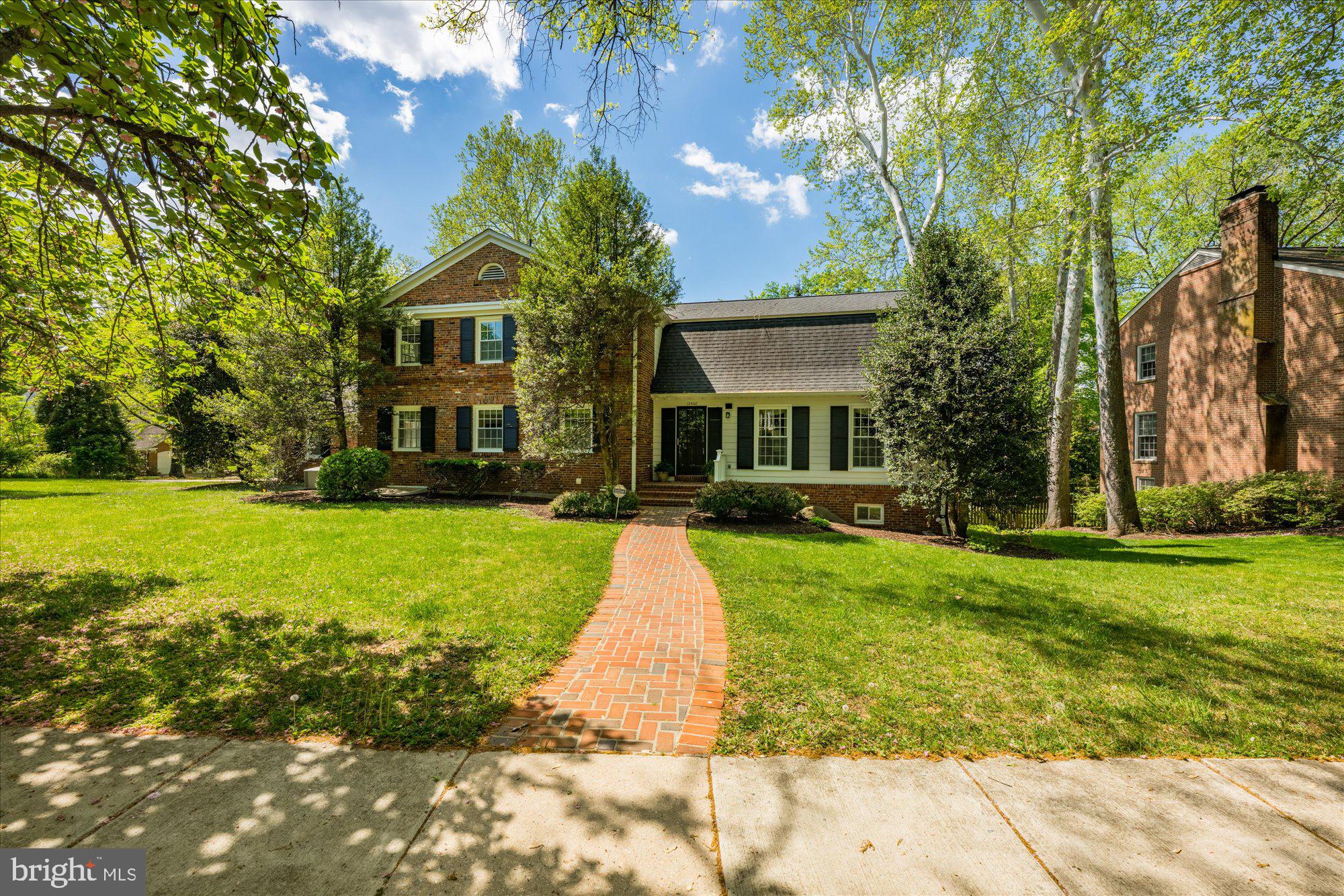 There's history here--and it shows in all the right ways.  Originally selected by the builder, Gosnell, as the showcase home for River Falls, this coveted "Compton" model is set on a larger, more prominent lot and thoughtfully enhanced with a side-entry garage- details that still set it apart today.  A nod to its beginnings remains, the original River Falls community map is still framed in the garage, a quiet reminder of the home's role at the very start of it all.  Over time, it has only gotten better.  Inside, classic architecture meets fresh, intentional updates.  The Dining Room is elevated with custom corner cabinets, while the beautifully renovated Custom Kitchen with its center island, stainless steel appliances and sunny eating area, opens to seamlessly to the Family Room where a gas fireplace creates an inviting everyday gathering space.  A formal Living Room offers a second fireplace for more refined entertaining, and the main level Library with a wall of built-ins - complete with an adjacent Full Bath-easily flexes as a main level in-law suite.  Upstairs, five well proportioned bedrooms include a spacious Primary Suite featuring a renovated marble bath with soaking tub, separate shower and double vanities - a true place to escape and rewind.  The daylight, walk-out Lower Level delivers on every front: expansive recreation space, a built-in wet bar, an additional bedroom and full bath ideal for an Au Pair - all this with walk-out access to the private backyard.  And then there's the outdoor living.  Thoughtfully designed and expertly installed hardscaping, including a flagstone terrace and steps  plus a beautifully curved deck, creates an effortless flow for entertaining.  With exterior lighting and a fully fenced backyard, the setting is perfect for family living or casual entertaining.  All of this in one of Potomac's most sought after communities, River Falls, known for it's vibrant Swim/Tennis Club, award winning teams and active, welcoming atmosphere with year-round activities.  Outdoor lovers will appreciate the exceptional proximity to Great Falls National Park and the C&O Canal.  Spend an hour there and it will feel like you had a vacation.  River Falls offers outstanding convenience, with easy access to the Clara Barton Parkway, connecting you to Tysons Corner, the I-270 BioMed Corridor and into downtown DC and Georgetown for world class museums, acclaimed dining and a plethora of shopping options.  Come make this your home for years to come!