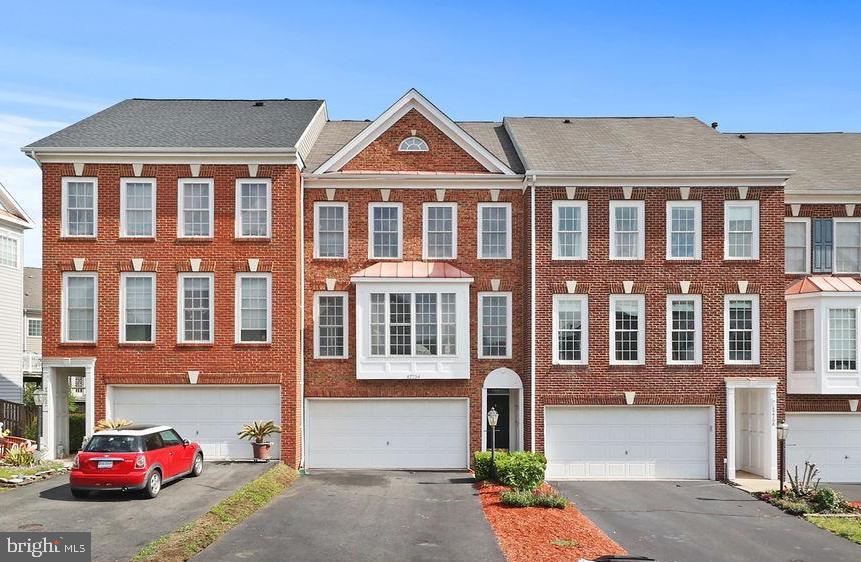 Welcome to this beautiful brick-front townhome featuring a 2-car garage, 3 bedrooms, and 2.5 bathrooms
Step inside to a bright and open layout with a sunken living room that walks out to a large Trex deck—ideal for relaxing or entertaining. Just a few steps up is the separate dining room, perfect for hosting. The kitchen includes an eat-in area, expansive windows, and plenty of natural light.
Upstairs, you'll find a spacious primary suite with a walk-in closet and an en-suite bath featuring a shower and tub combo. Two additional bedrooms, a full hall bath, and convenient laundry complete the upper level.
The finished walk-out basement offers a cozy rec room that leads to a fully fenced backyard—great for extra living space or a home office setup. Perfectly located just minutes from Routes 7 and 15 and the Leesburg Premium Outlets. Enjoy nearby shopping, dining, and conveniences with Target, Costco, and Downtown Leesburg just minutes away.