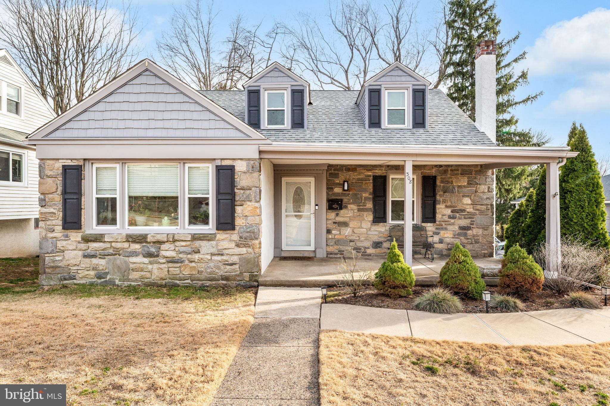 Welcome home to 308 Providence Road, a stone cape cod nestled on a peaceful cul-de-sac, with a private drive. Step onto the inviting front porch, perfect for morning coffee or relaxing evenings, and into a bright, welcoming home starting with an open concept living/dining area with hardwood floors and plenty of natural light.  The updated kitchen features white cabinetry, stainless steel appliances, all ideal for everyday cooking and entertaining.  From the kitchen, step right out onto a maintenance free deck.  Also on the main level are two generously sized bedrooms with plenty of closet space and a full bathroom with updated fixtures, a layout designed for both comfort and convenience.  The second floor also has two generously sized bedrooms and a full bath as well as closet space and storage crawl spaces and newly updated flooring.  A finished basement is another perk of this adorable home.  It’s currently used as a recreation room, with a built-in bar, but the options are endless.  It would work perfectly as a home gym, work from home space, playroom, or second family room.  There is also a tremendous amount of storage space in the basement, in addition to a laundry area.  This basement is a walk out basement via sliders to a patio and the deep private backyard, complete with storage shed.   This home is located within Springfield School District and convenient to public transportation, schools, shopping, dining and more!  Don’t miss out on this wonderful opportunity to call this home yours!